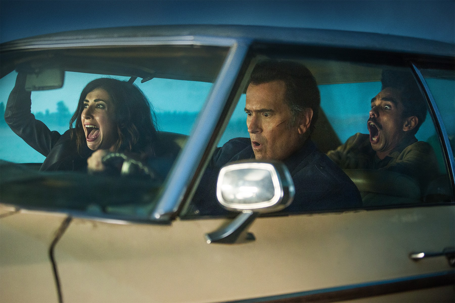 Dana DeLorenzo and two men in a car HD Wallpaper