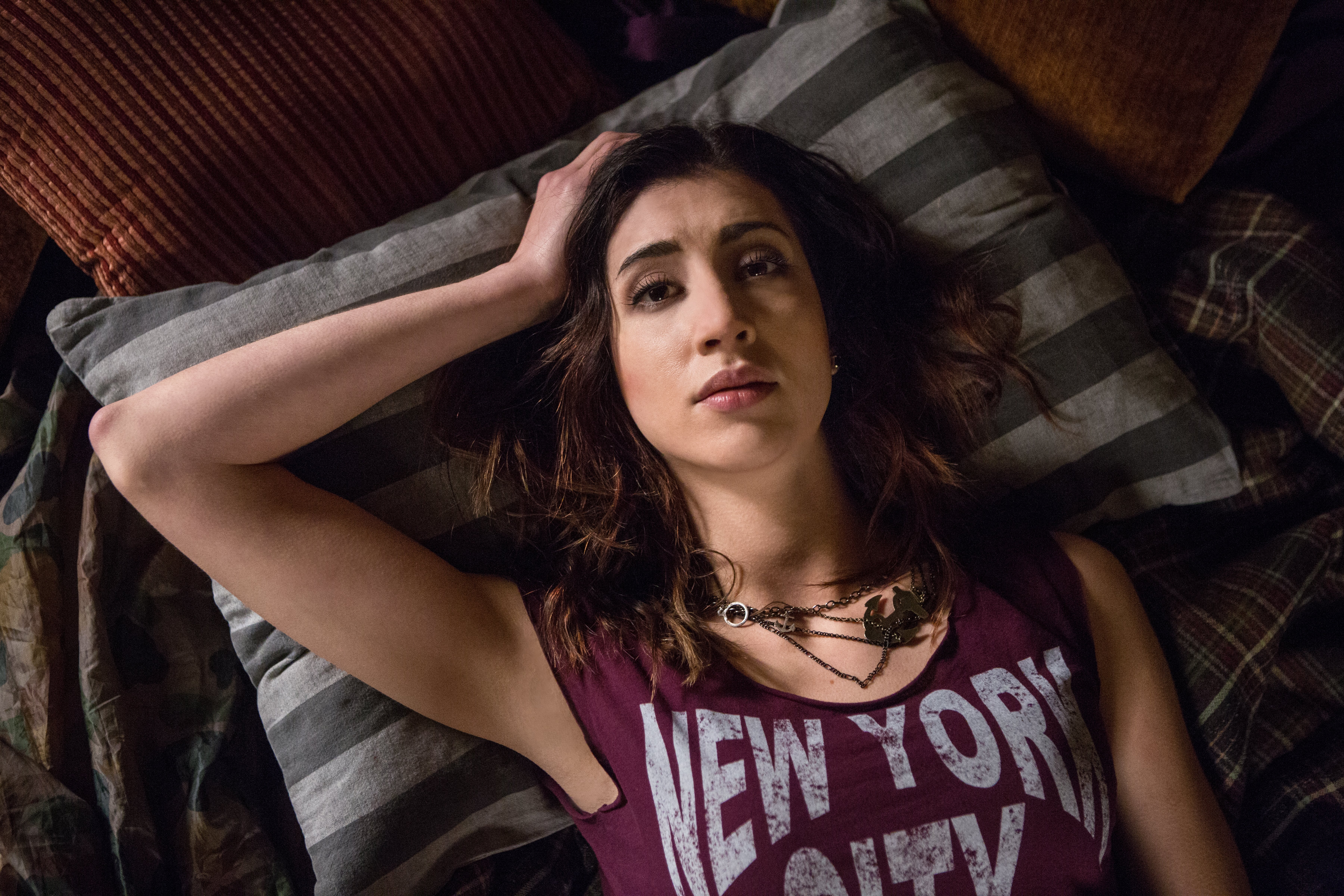 Dana DeLorenzo lying on a bed HD Wallpaper