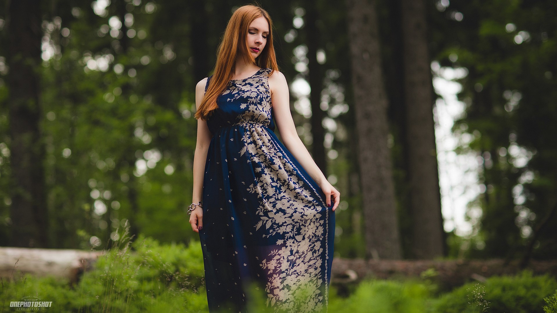 Woman in a floral dress in a forest HD Wallpaper