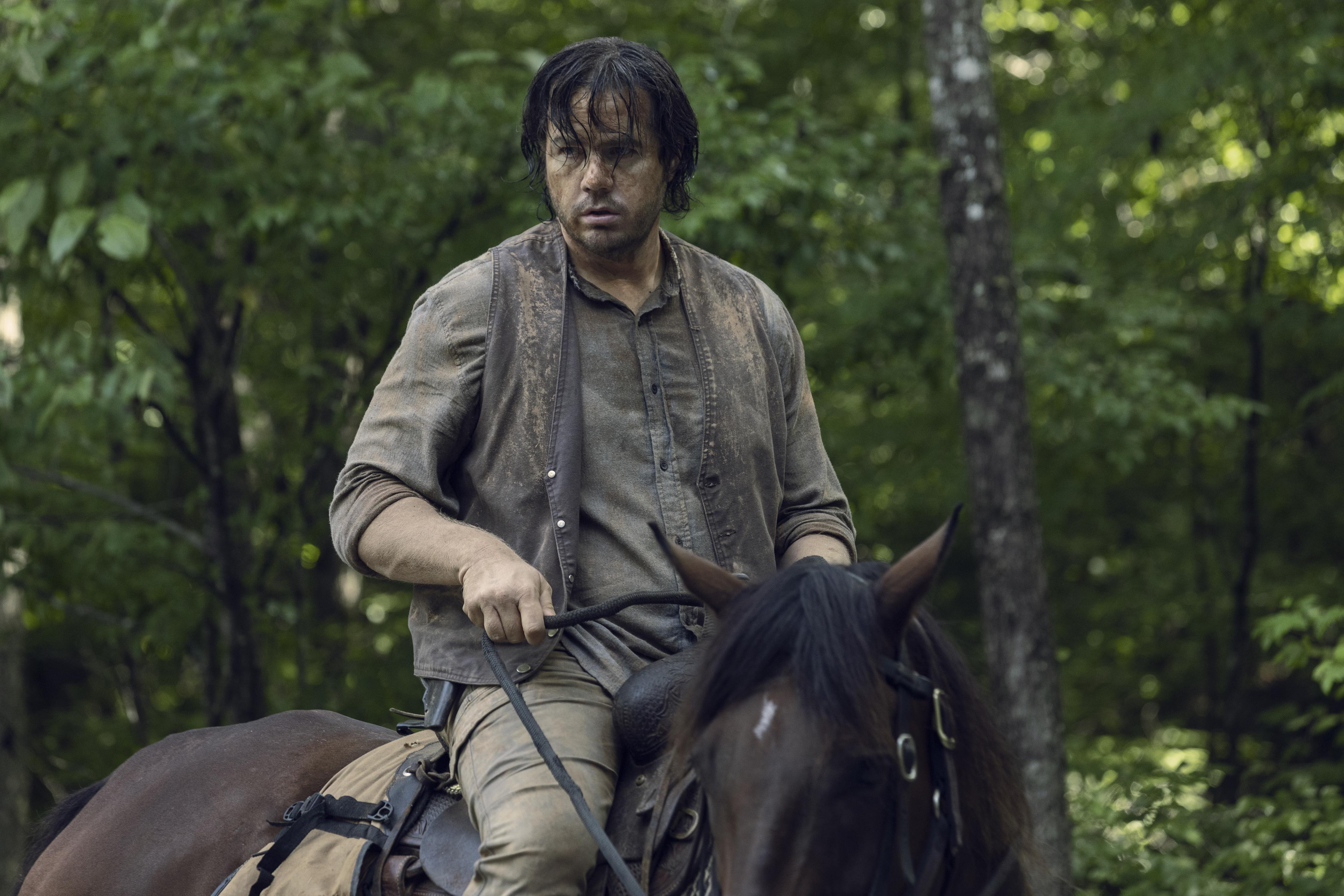 Josh McDermitt on horseback in a forest HD Wallpaper