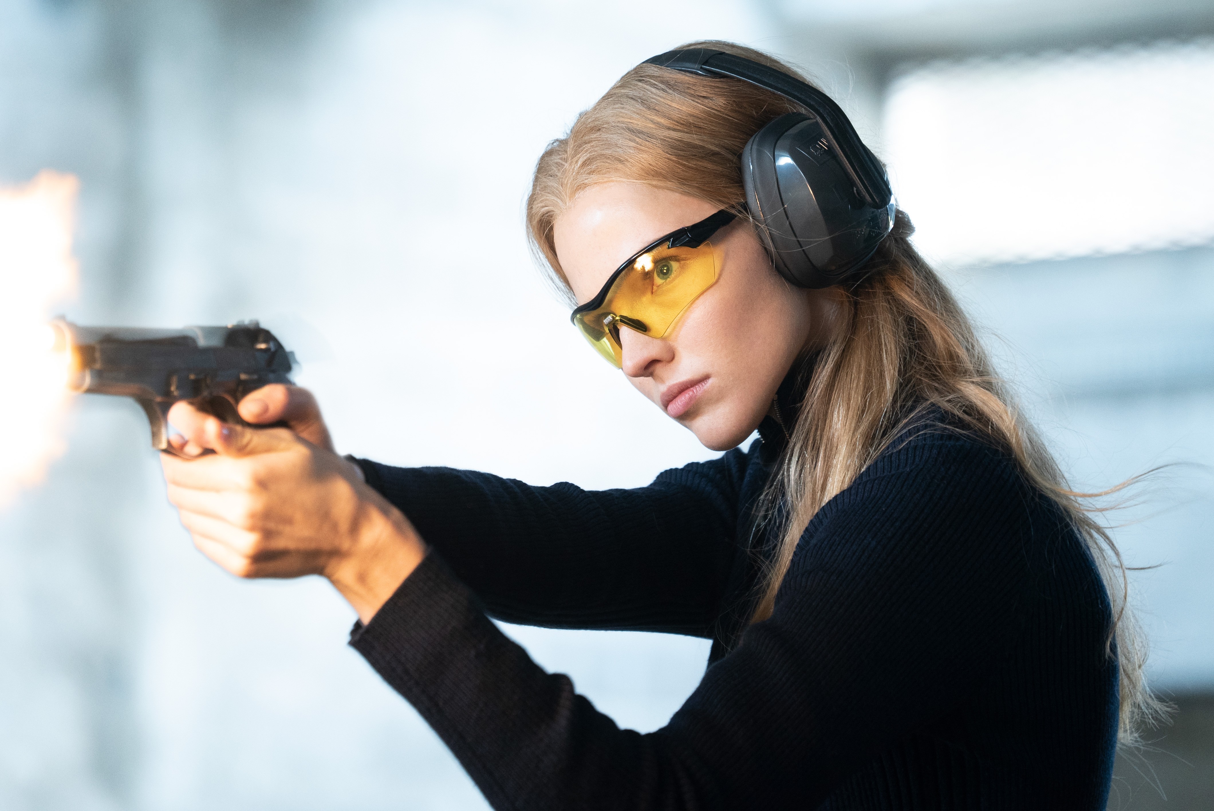 Sasha Luss firing a handgun HD Wallpaper