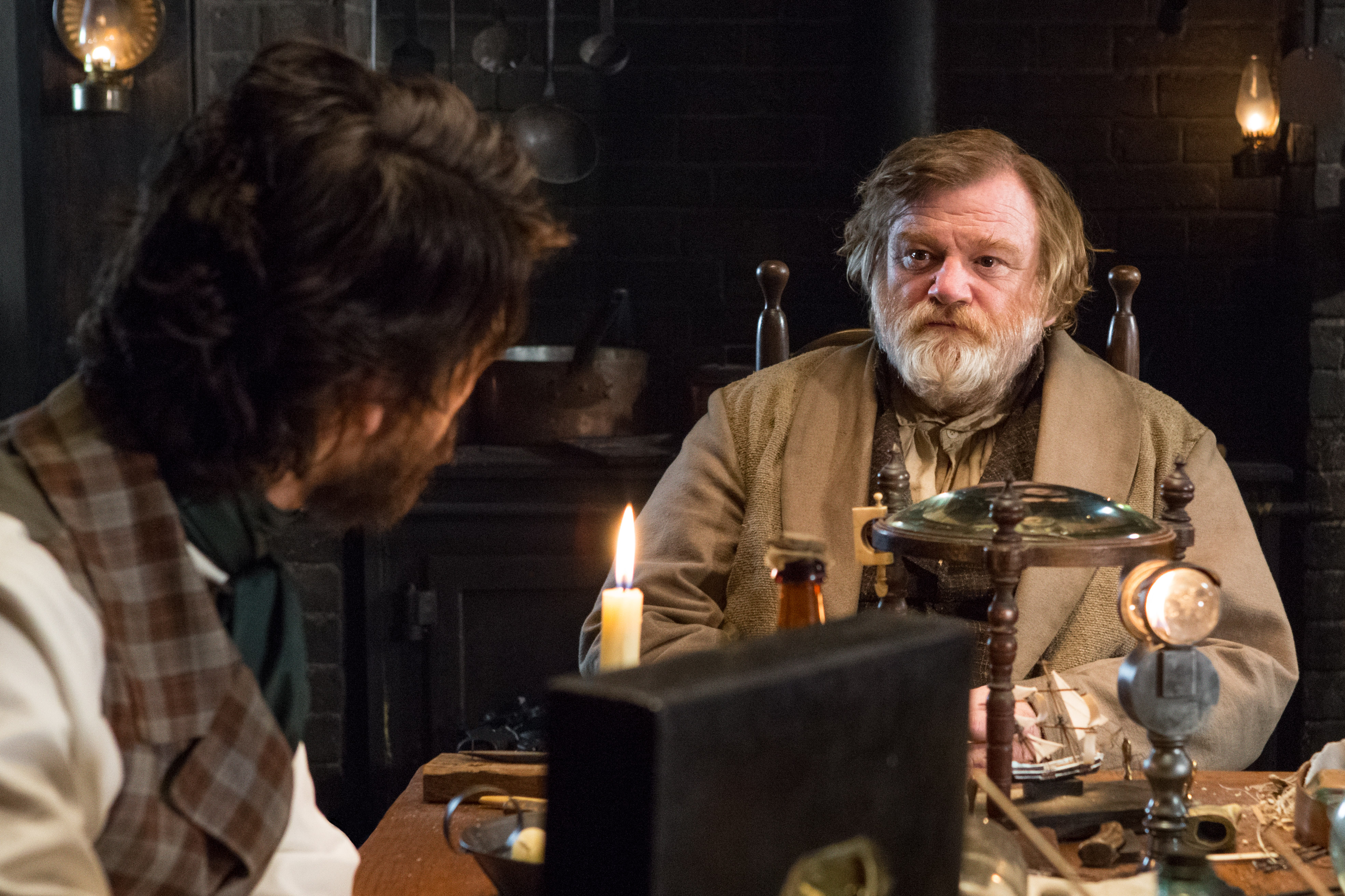 Brendan Gleeson in a dimly lit room HD Wallpaper