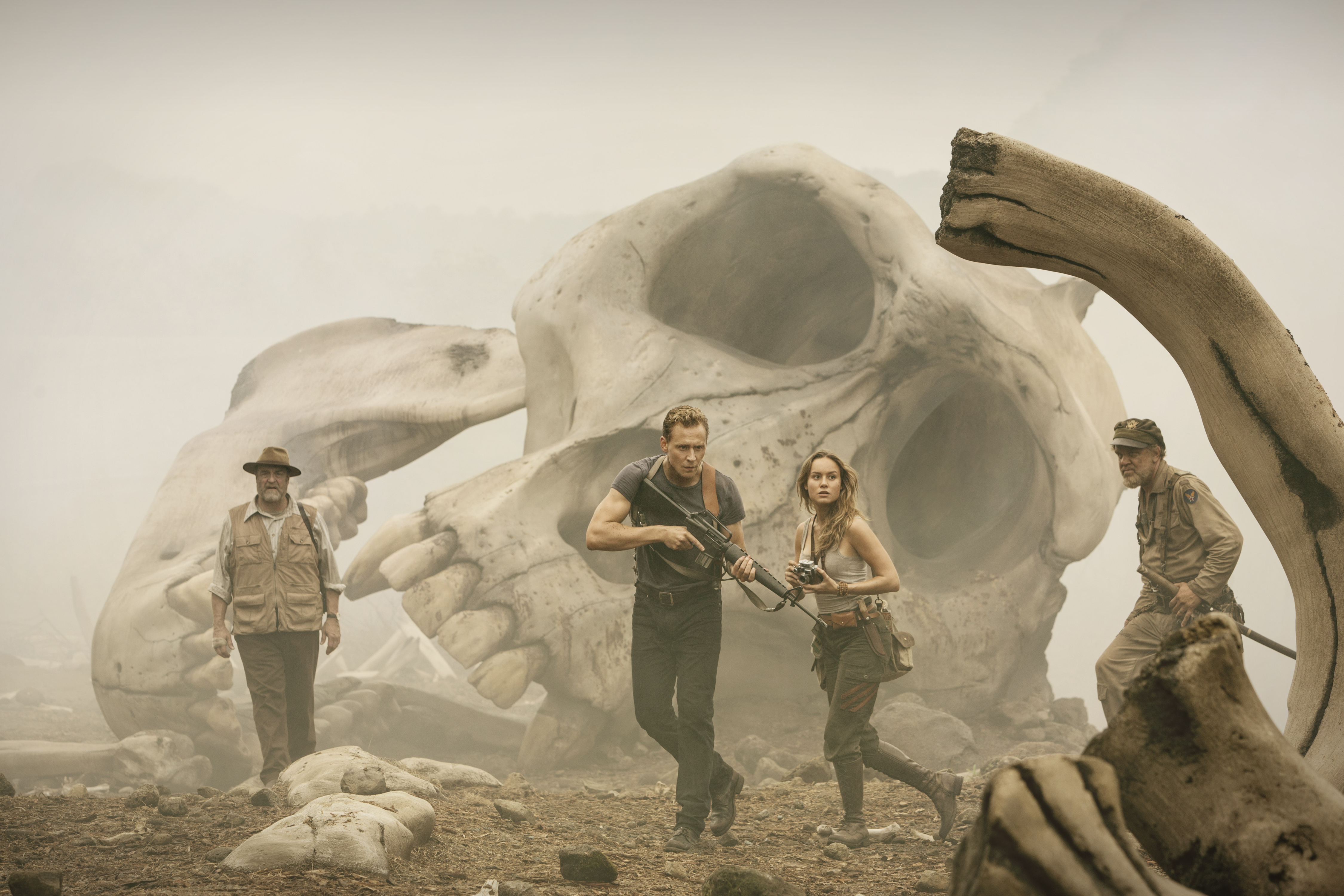 John Goodman and companions in front of giant skull HD Wallpaper