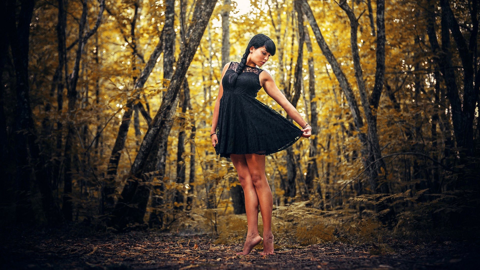 Woman in black dress in autumn forest HD Wallpaper