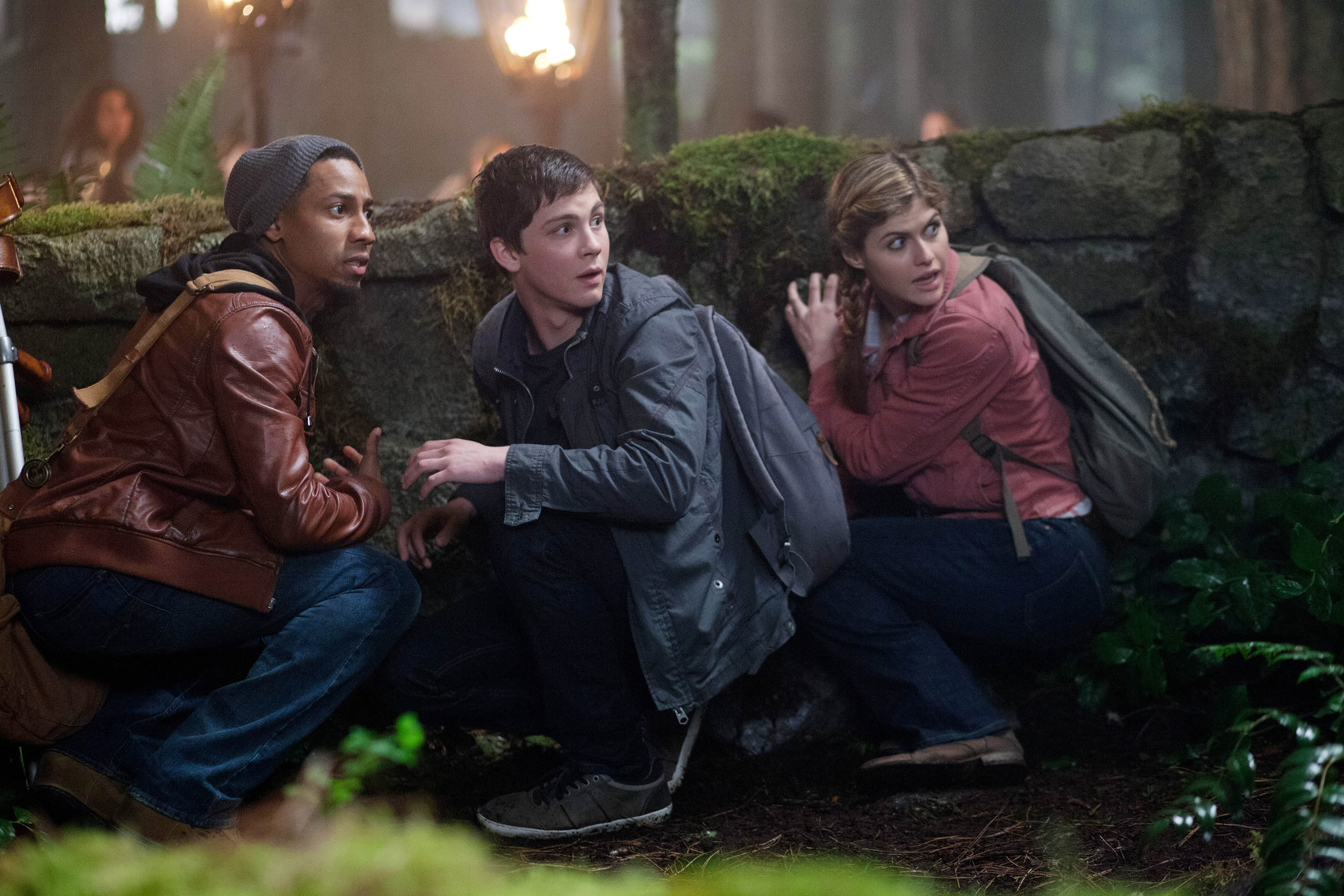 Logan Lerman and two friends hiding in a forest HD Wallpaper