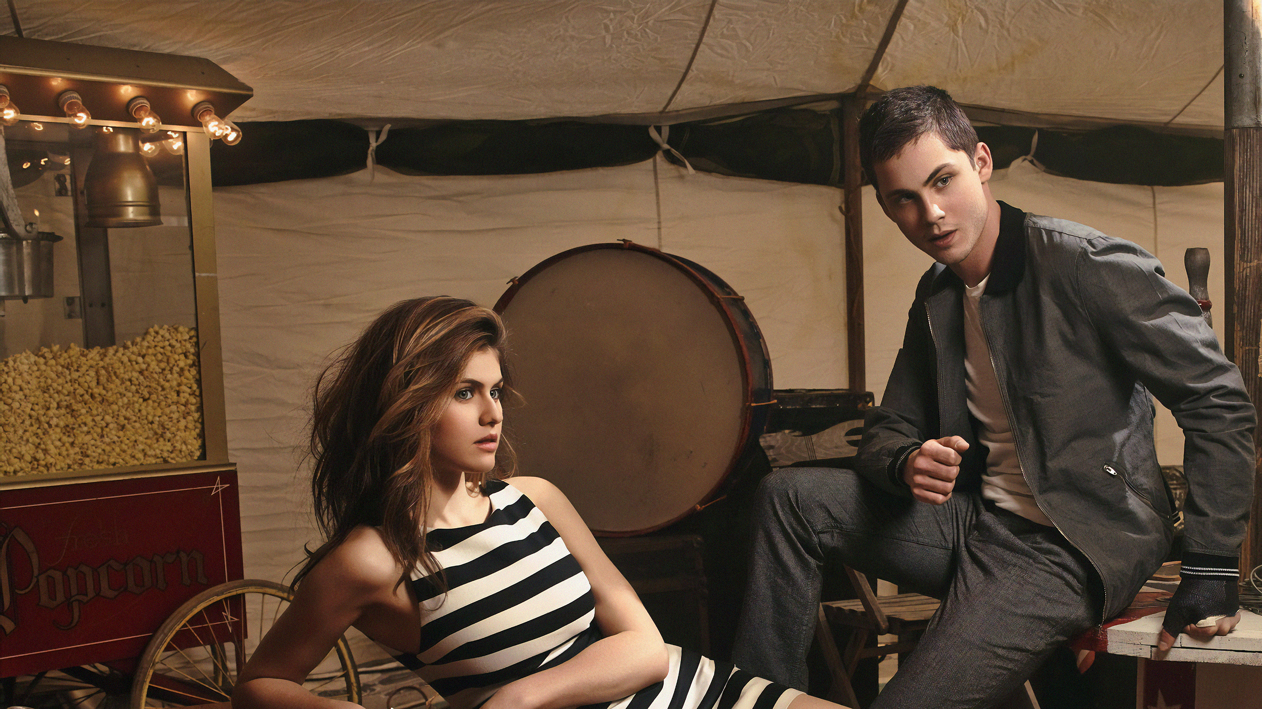 Logan Lerman and Alexandra Daddario in a circus tent HD Wallpaper