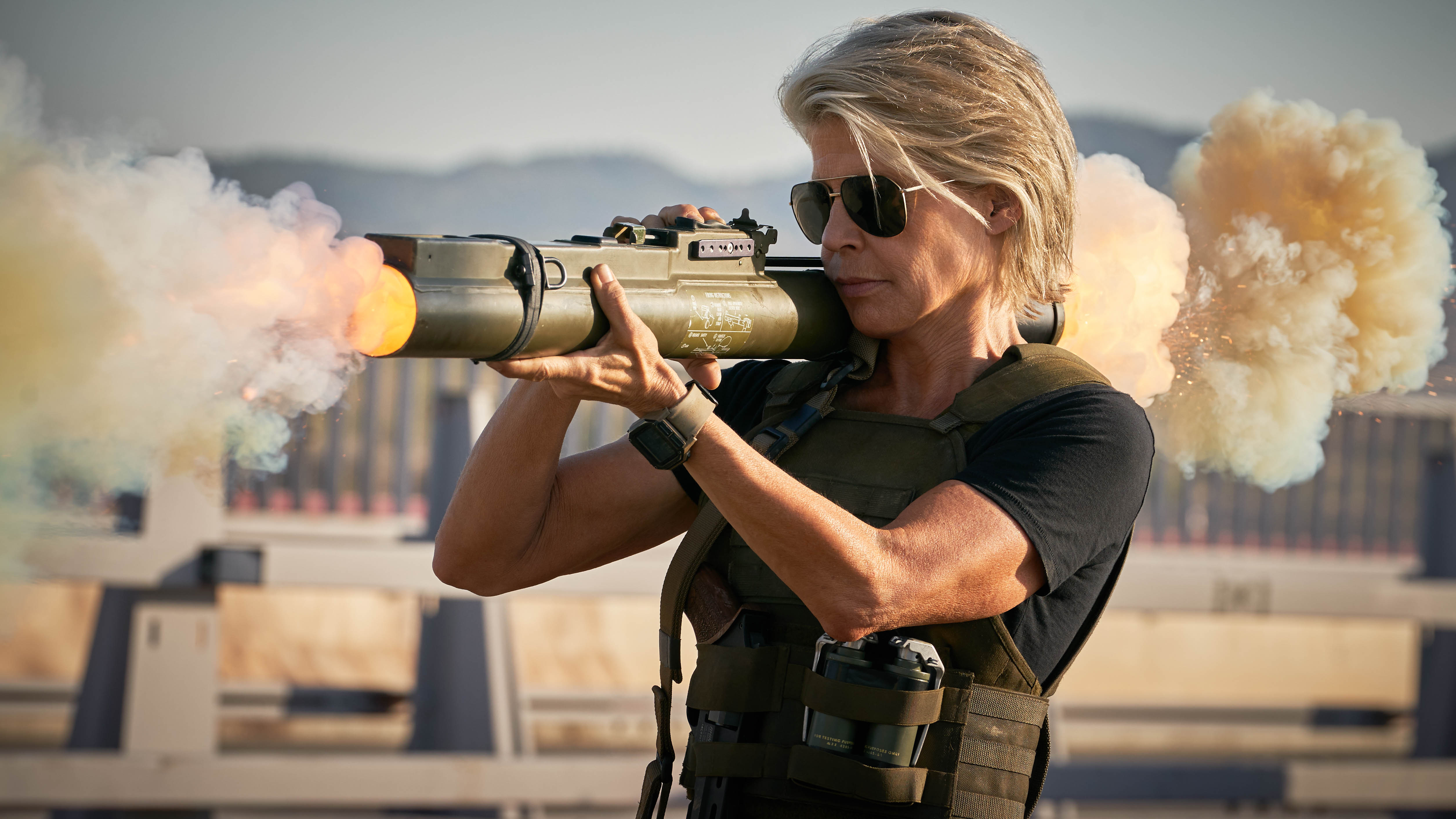 Linda Hamilton firing a rocket launcher HD Wallpaper