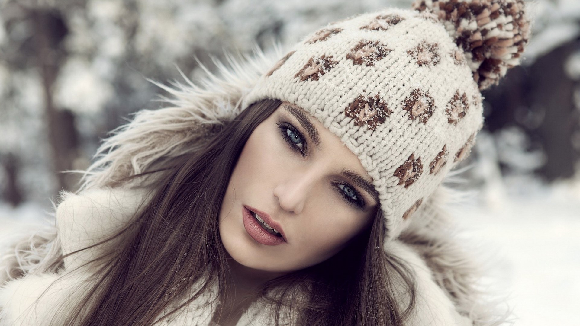 Woman in a knitted hat and fur coat in the snow HD Wallpaper