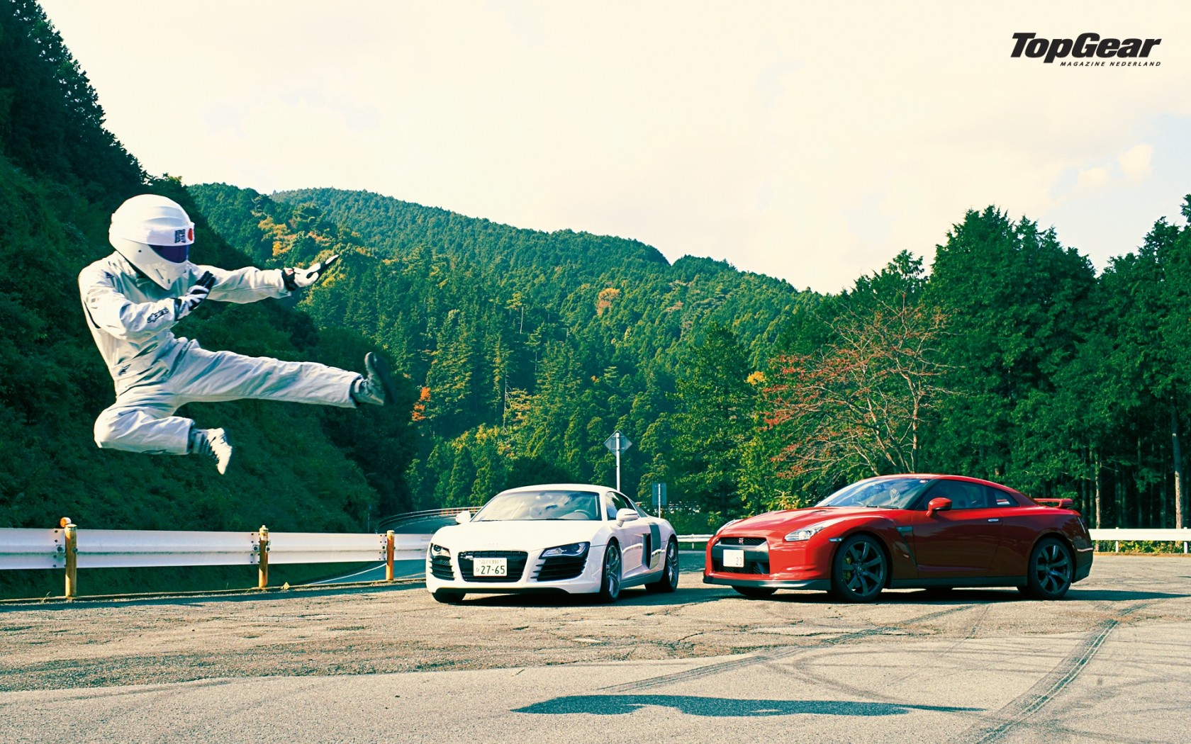 Ben Collins performing a flying kick with Audi R8 and Nissan GT-R HD Wallpaper
