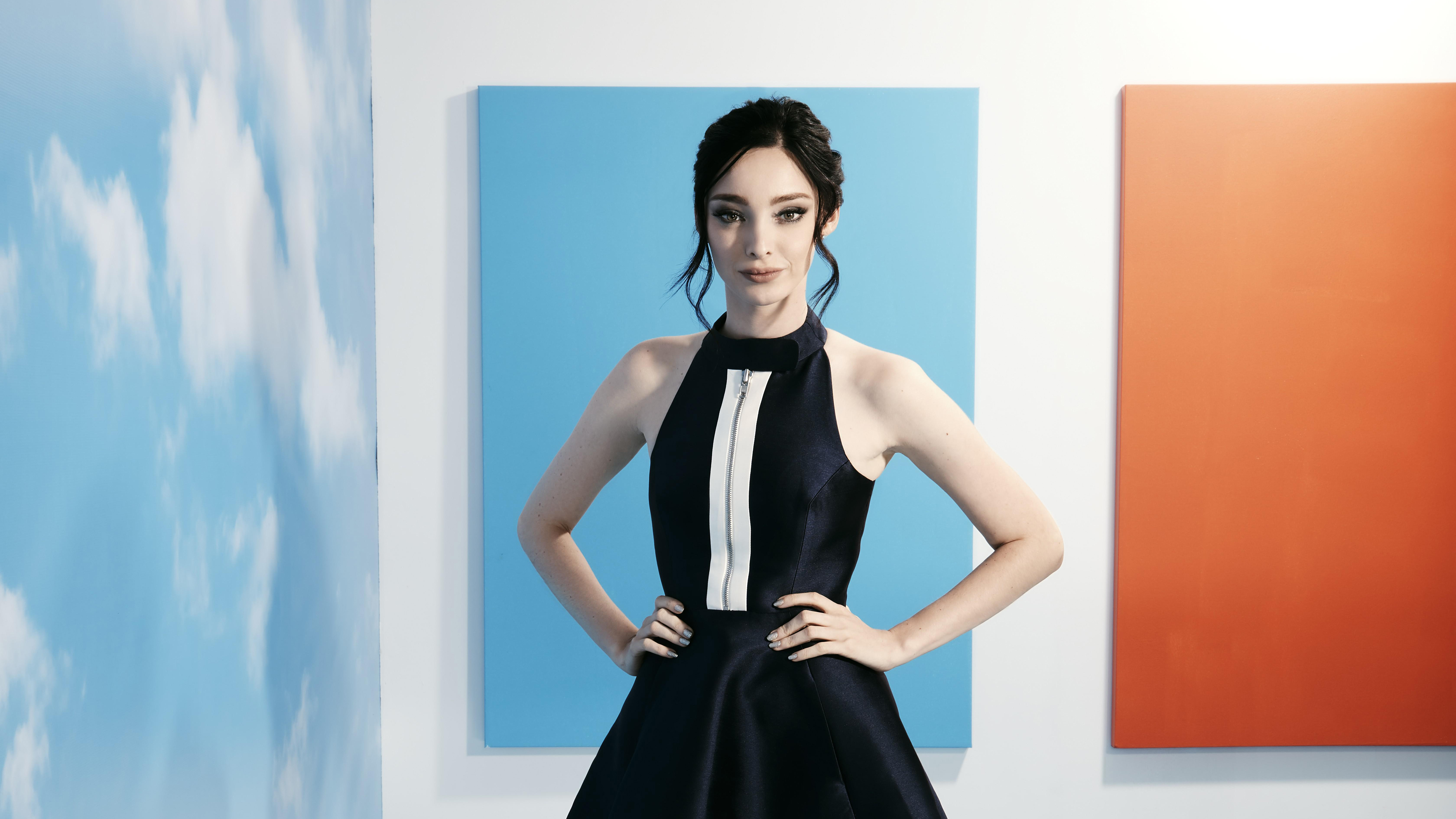 Emma Dumont in a dark dress HD Wallpaper