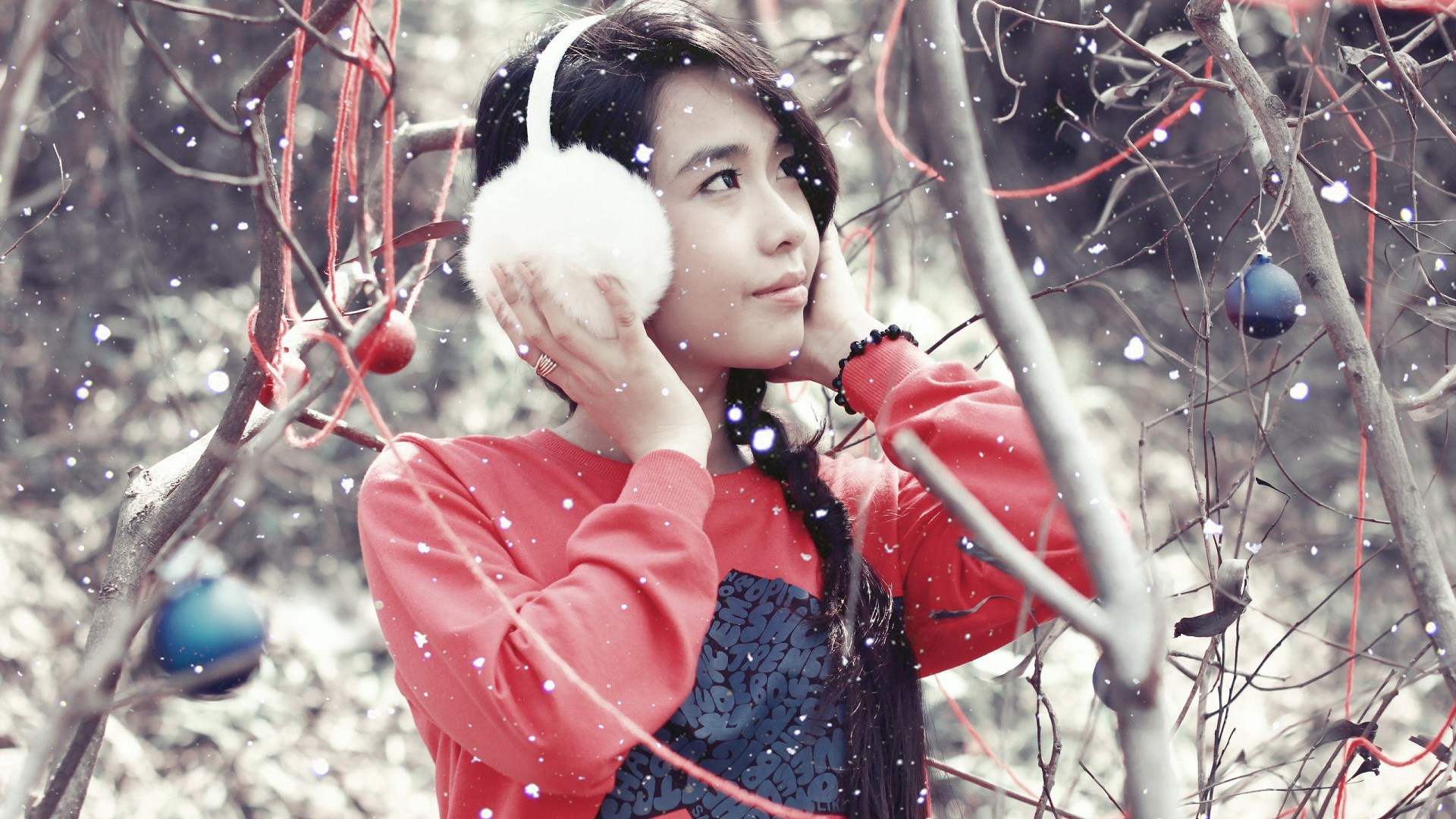 Girl wearing earmuffs and red sweater with ornaments HD Wallpaper