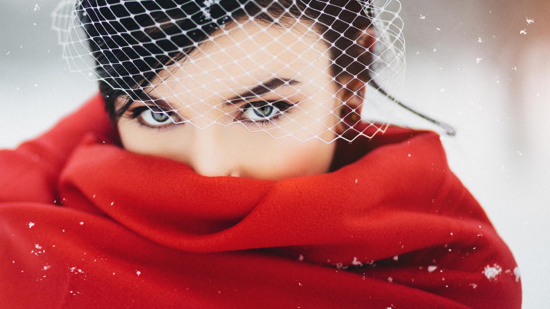 Woman in red scarf and veil in snow HD Wallpaper