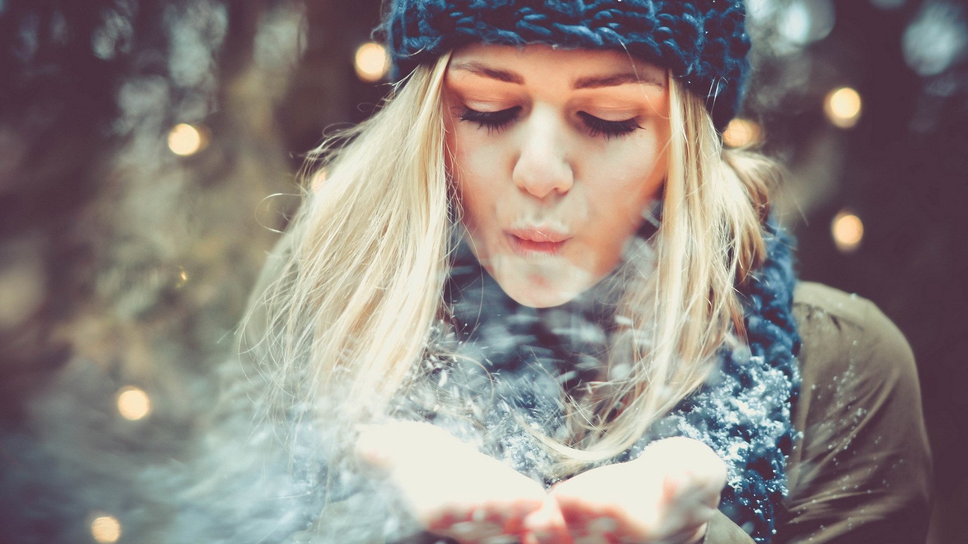 Woman blowing snow in winter HD Wallpaper