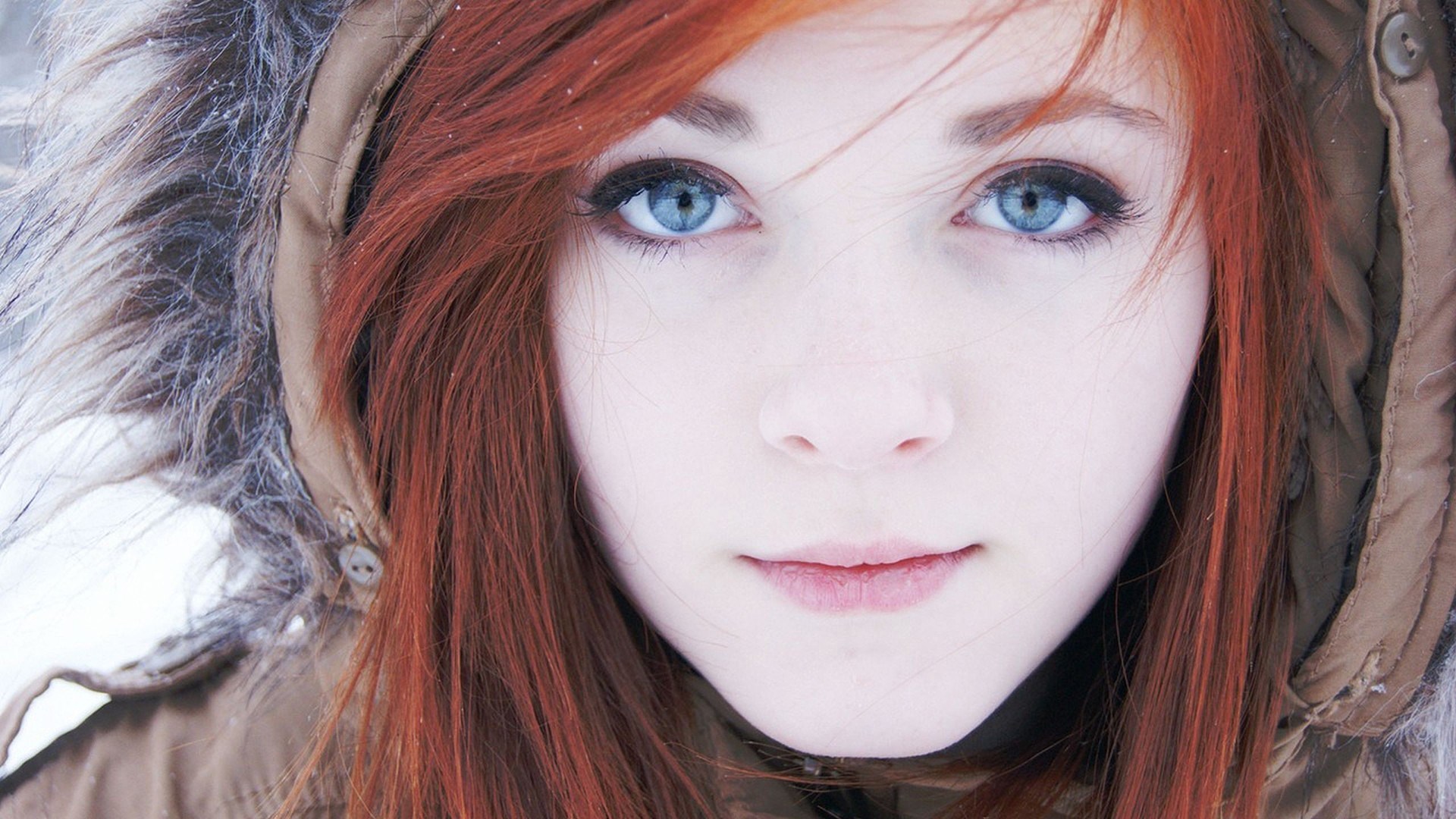 Close-up of a young woman with red hair and blue eyes HD Wallpaper