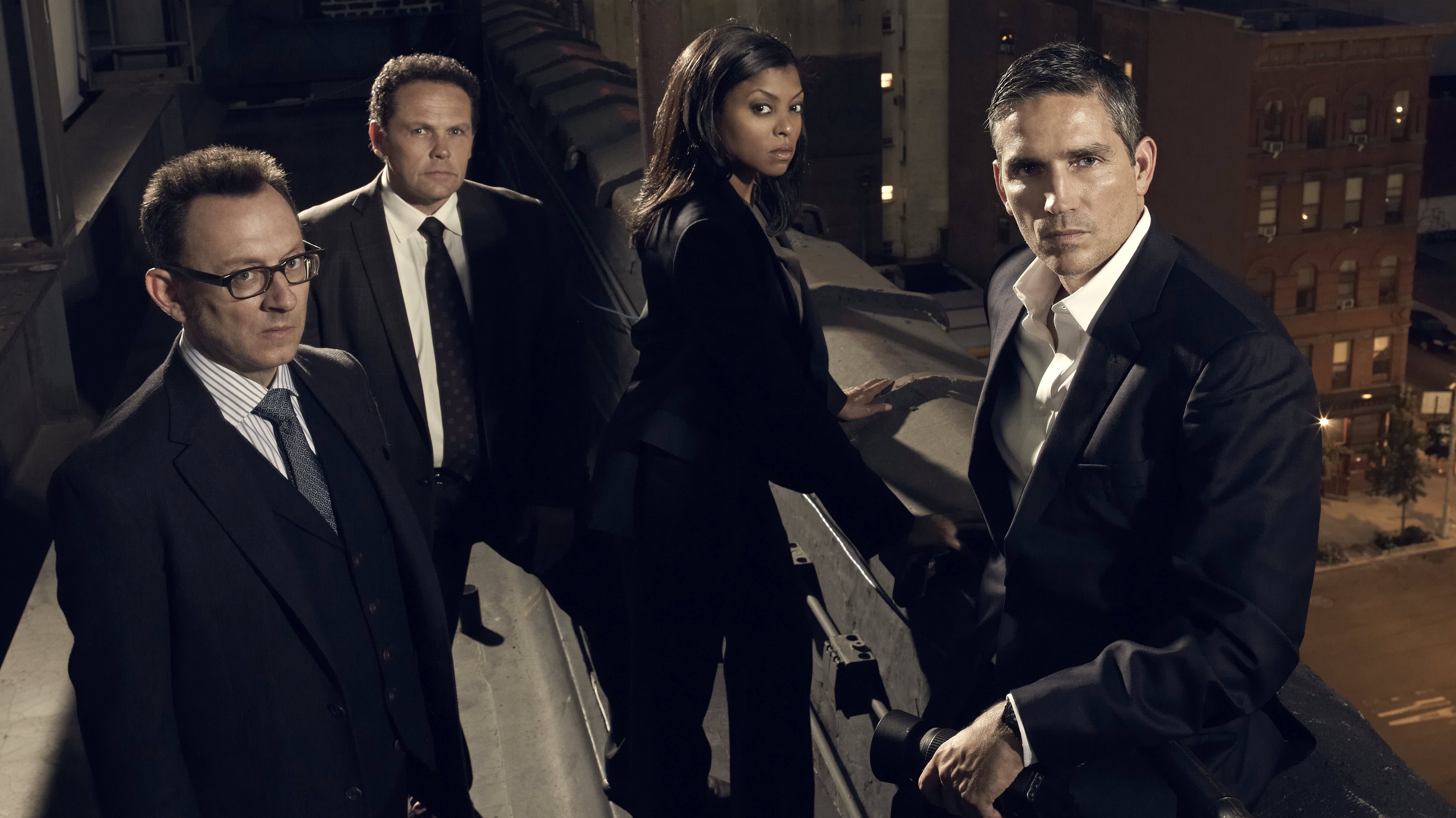 Four people in suits on a rooftop HD Wallpaper