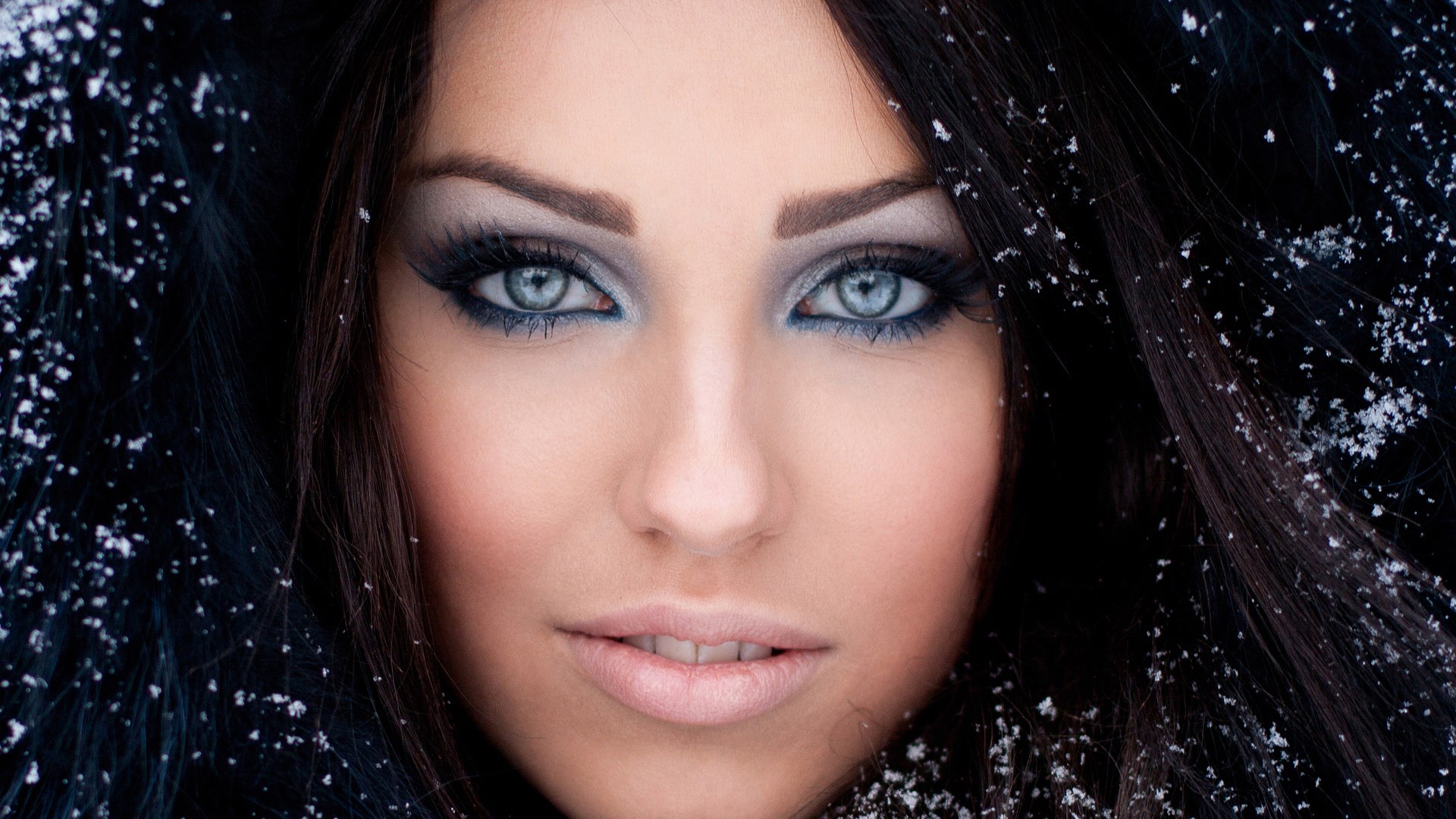 Woman with blue eyes and snow HD Wallpaper