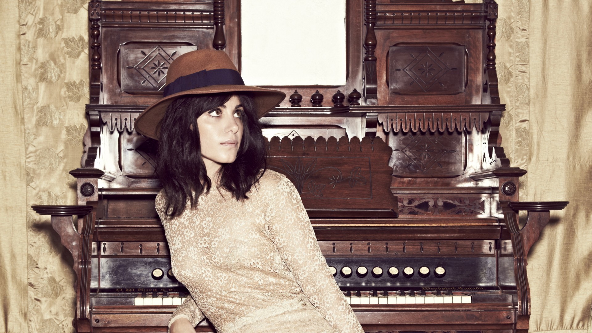 Katie Melua sitting by an antique organ HD Wallpaper