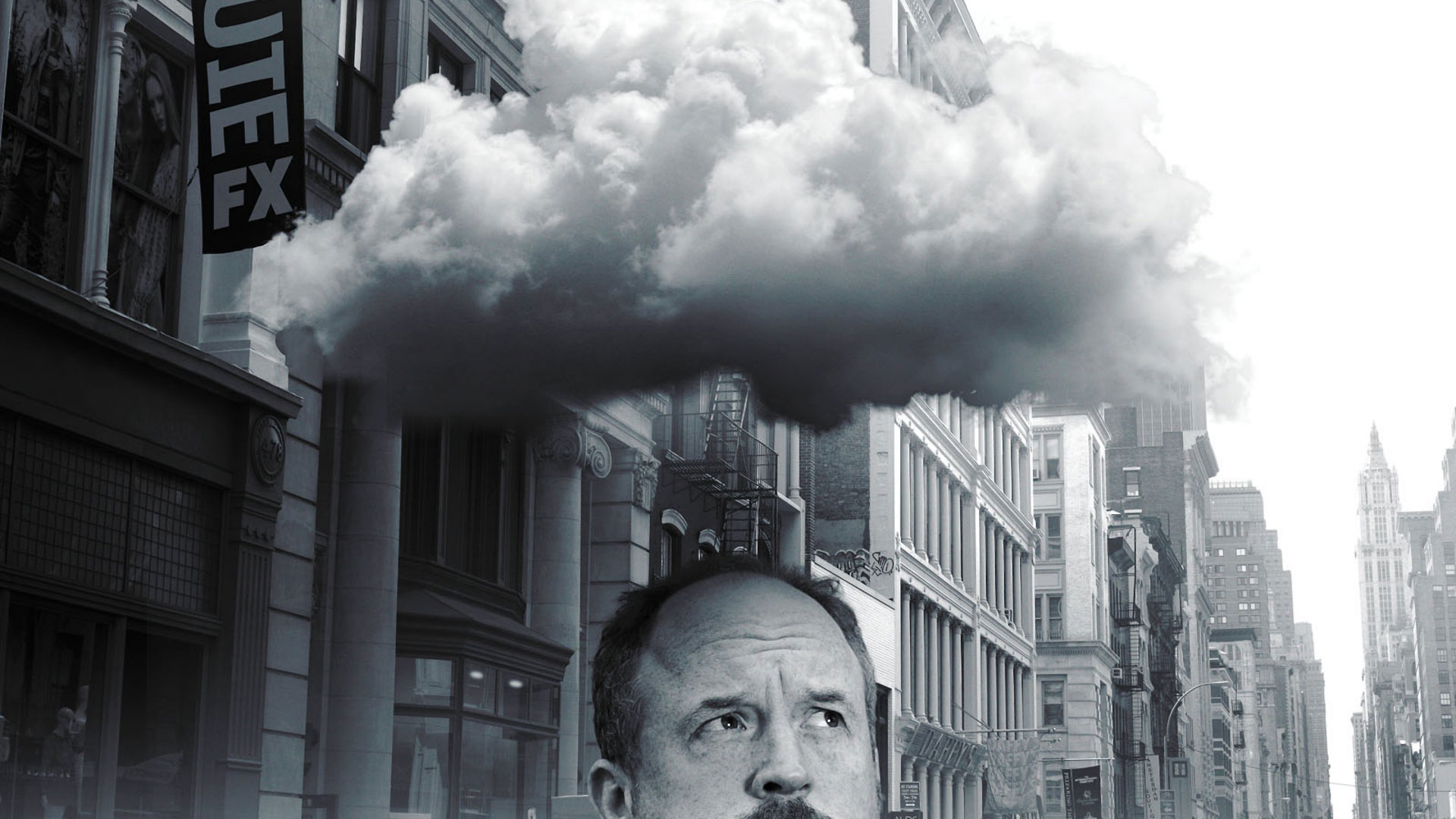 Louis C.K. in a city with a cloud overhead HD Wallpaper
