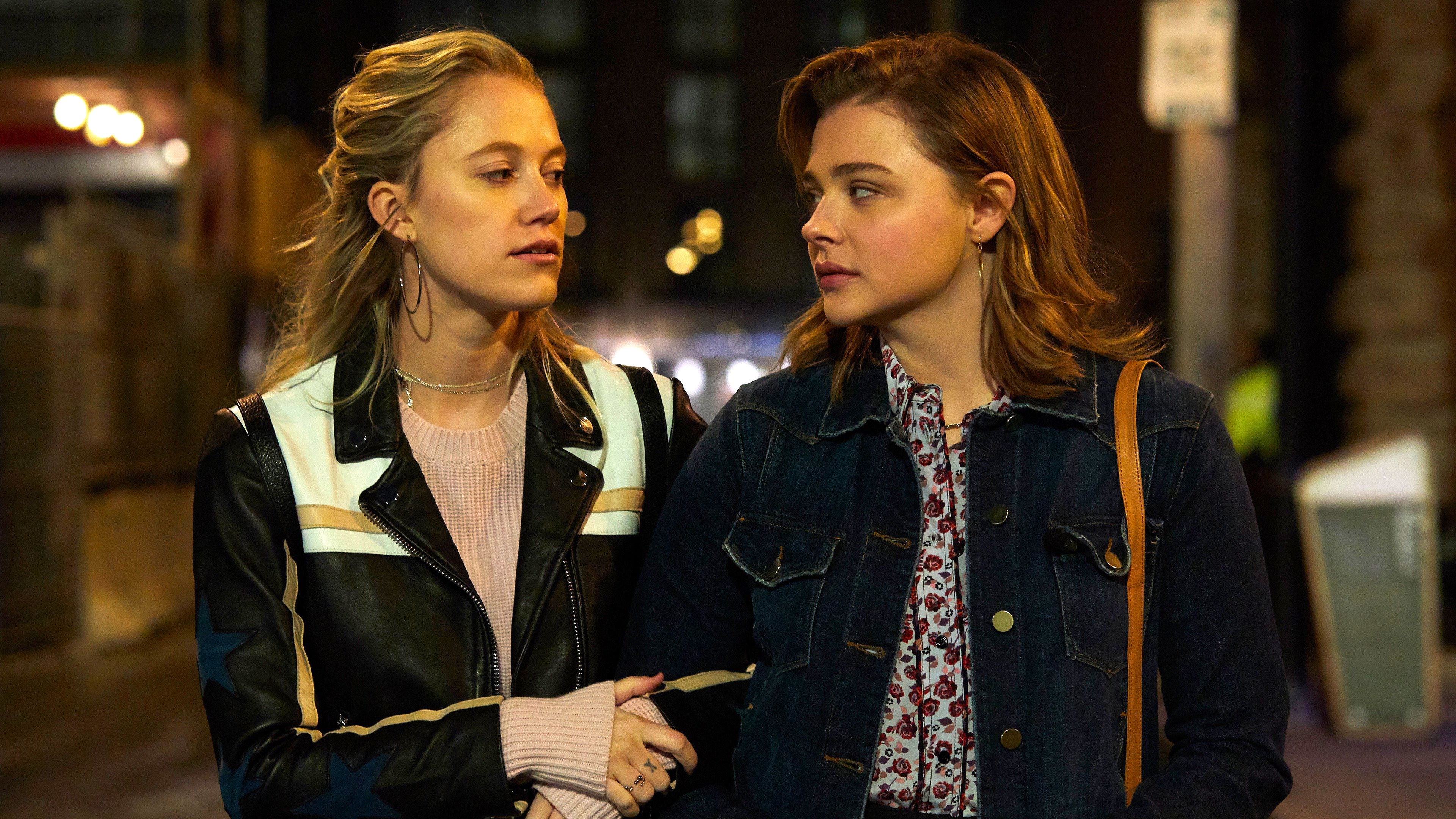 Maika Monroe and Chloe Grace Moretz walking at night HD Wallpaper