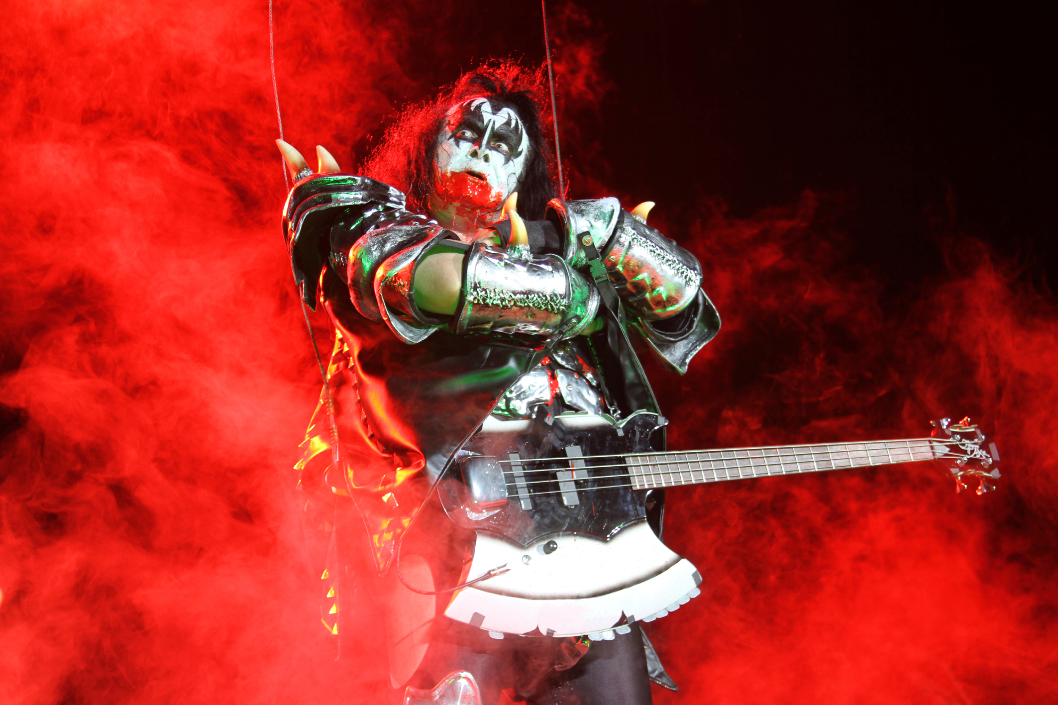 Gene Simmons from Kiss performing on stage HD Wallpaper