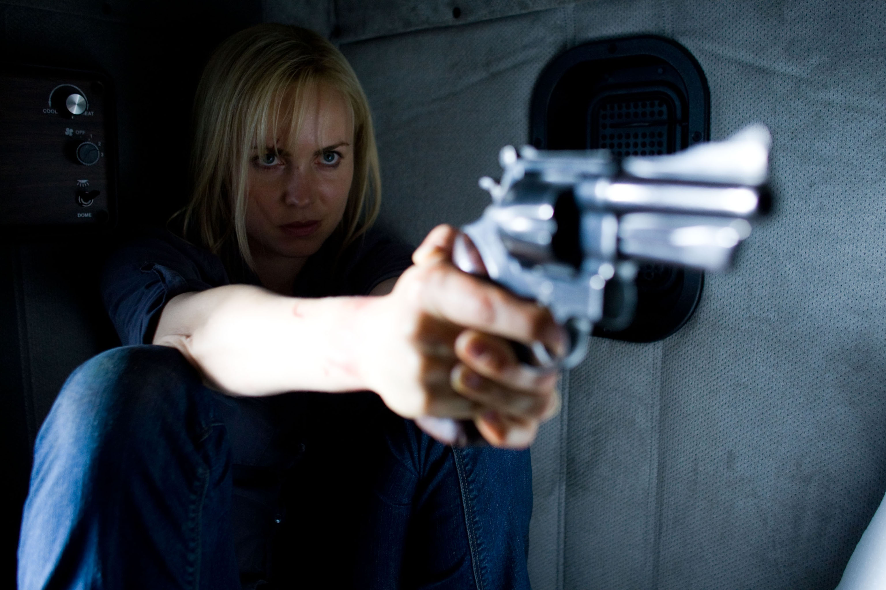 Radha Mitchell holding a gun HD Wallpaper