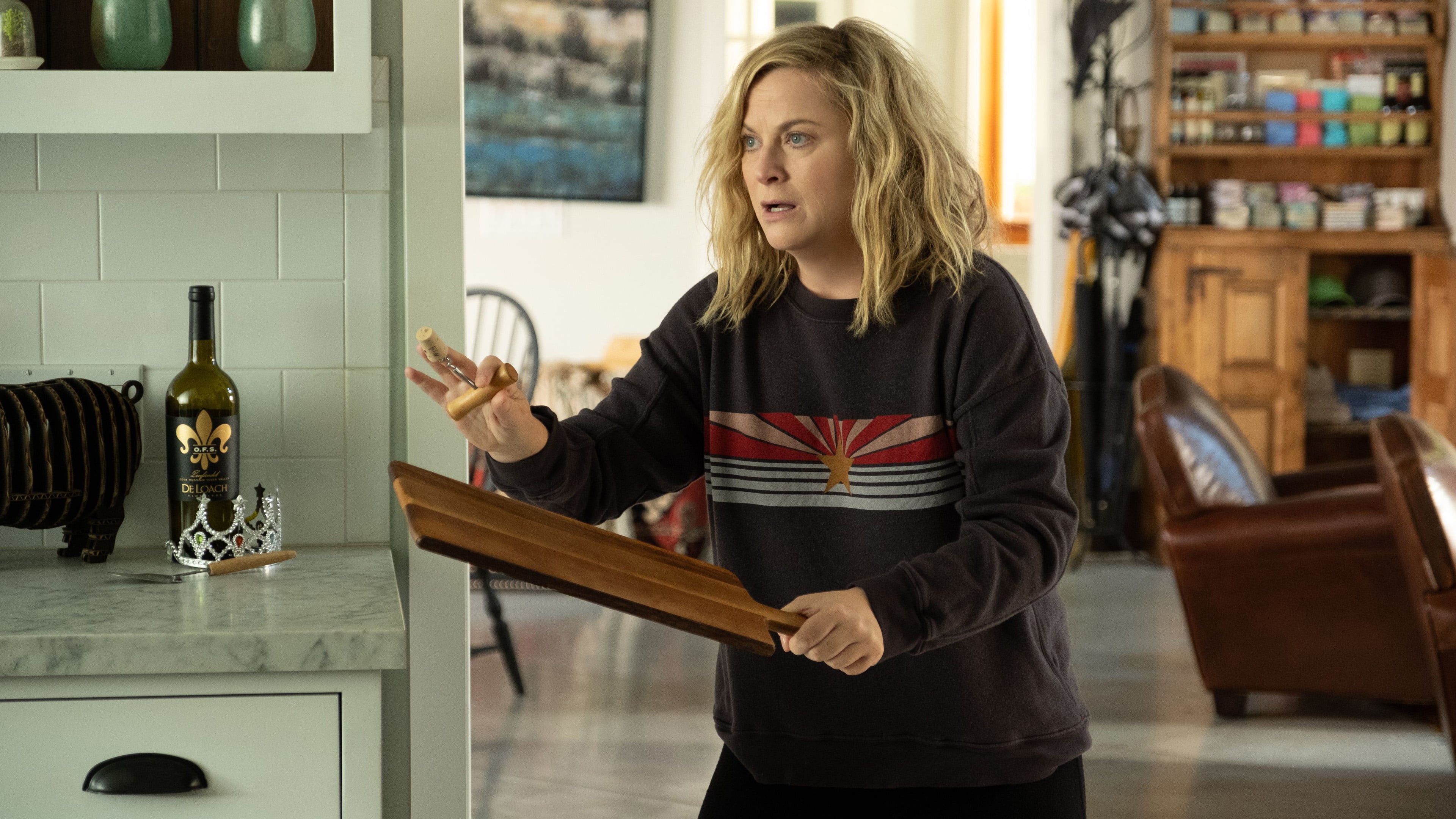 Amy Poehler holding a wooden paddle HD Wallpaper