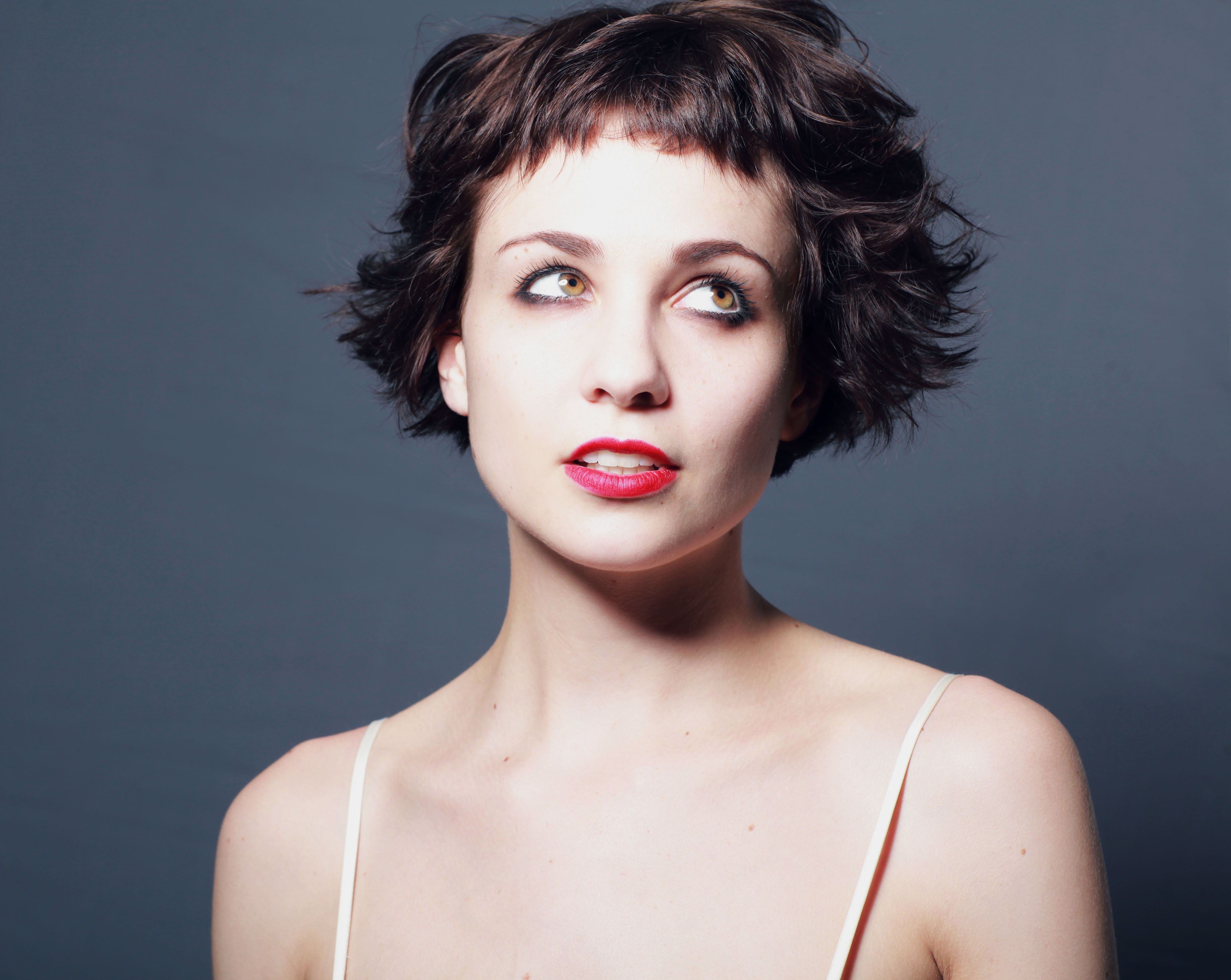 Young Woman with Short Wavy Hair and Red Lipstick HD Wallpaper