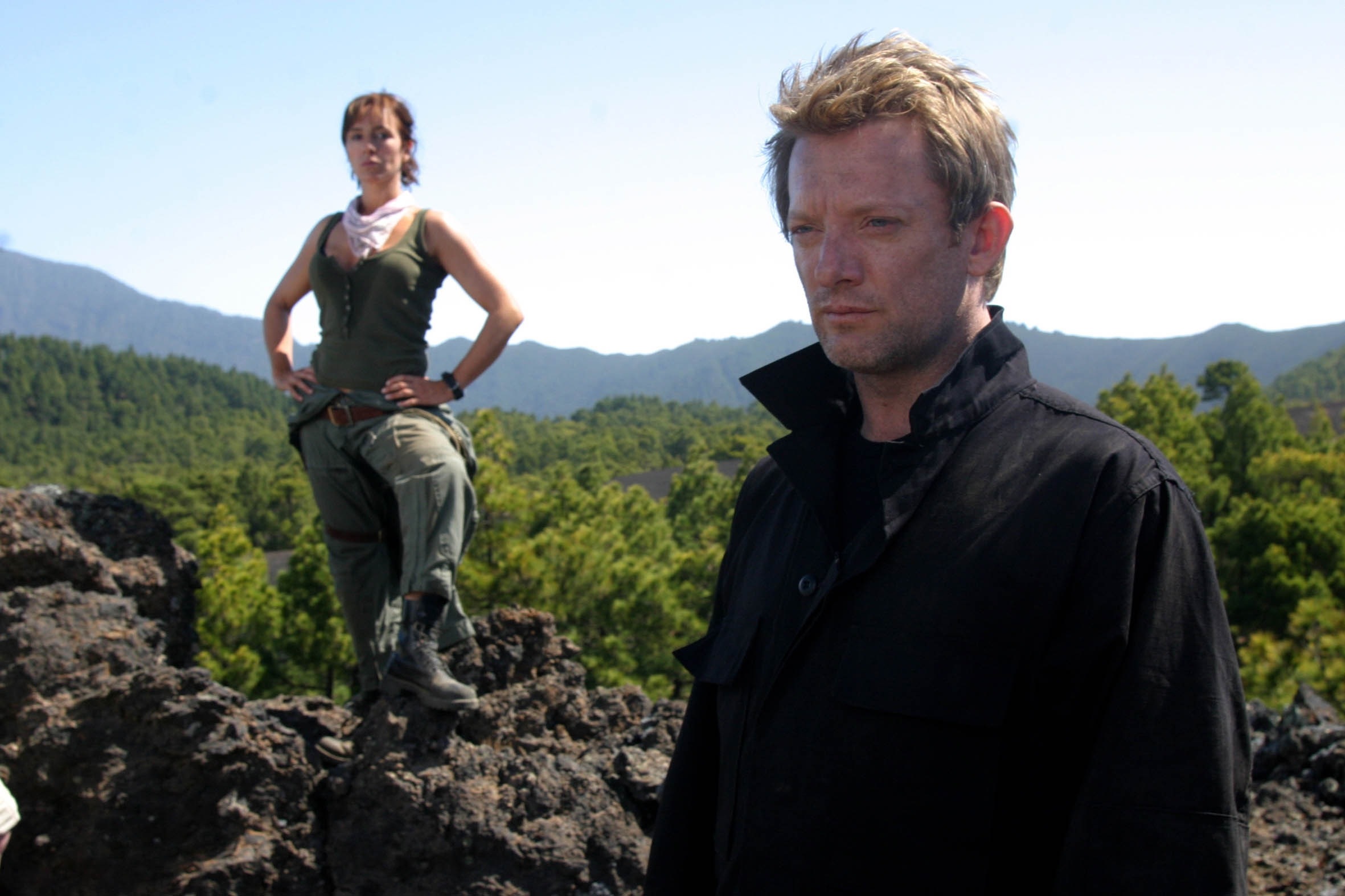 Douglas Henshall and woman on rocky terrain HD Wallpaper