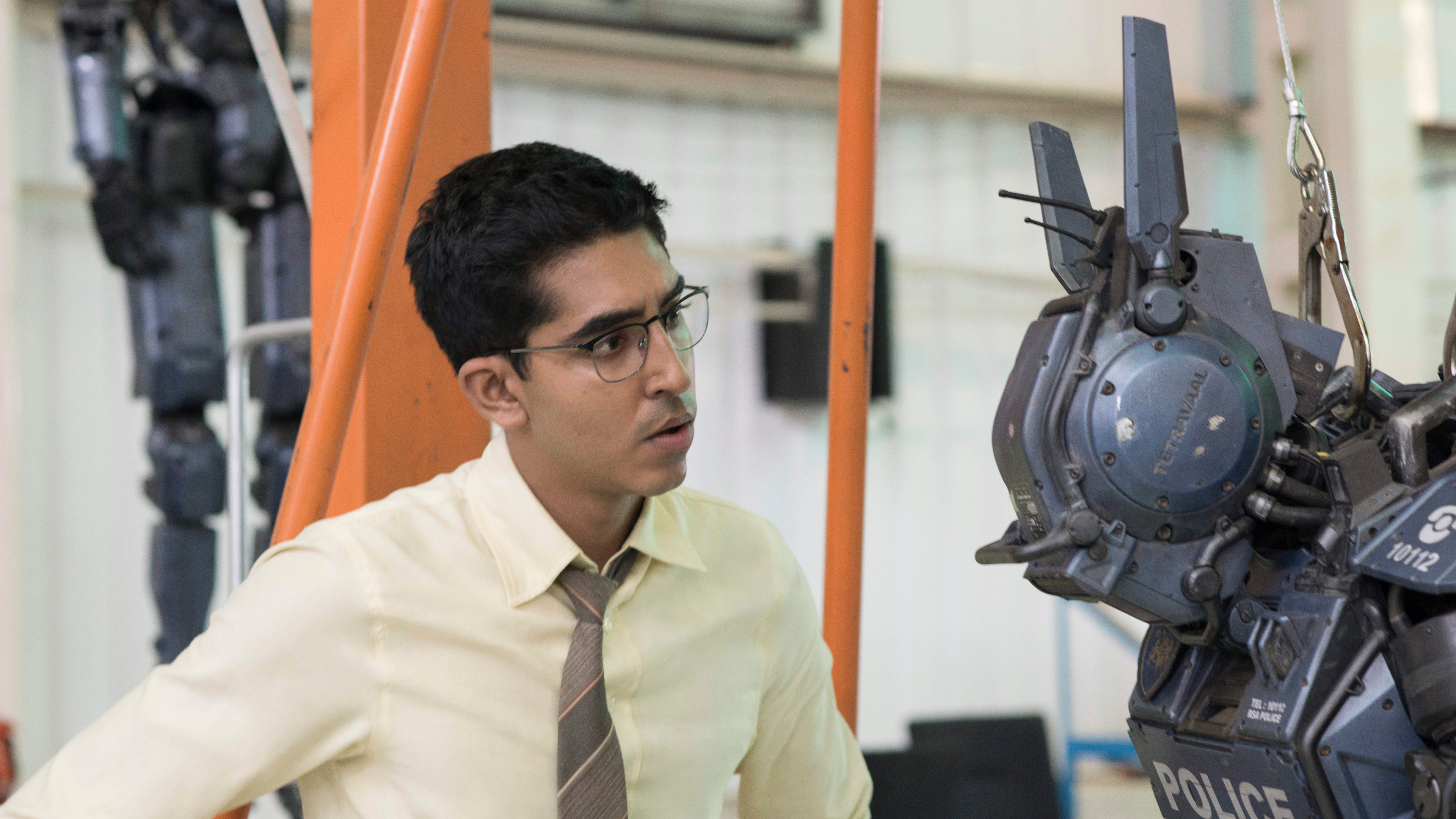 Dev Patel and a robot HD Wallpaper