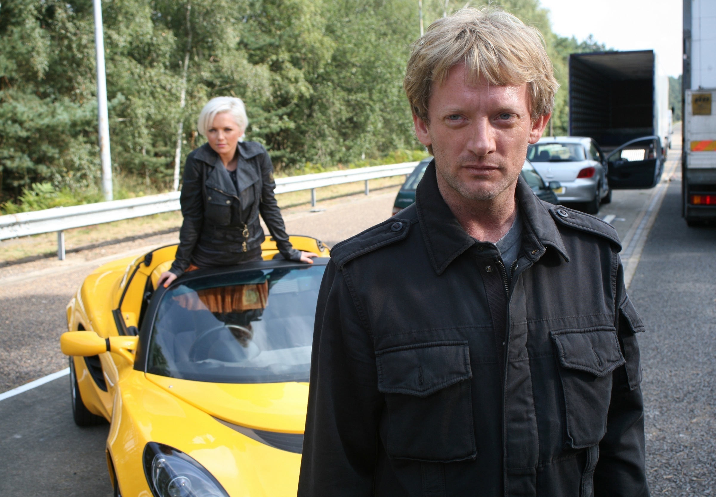 Douglas Henshall with a woman and a yellow sports car HD Wallpaper