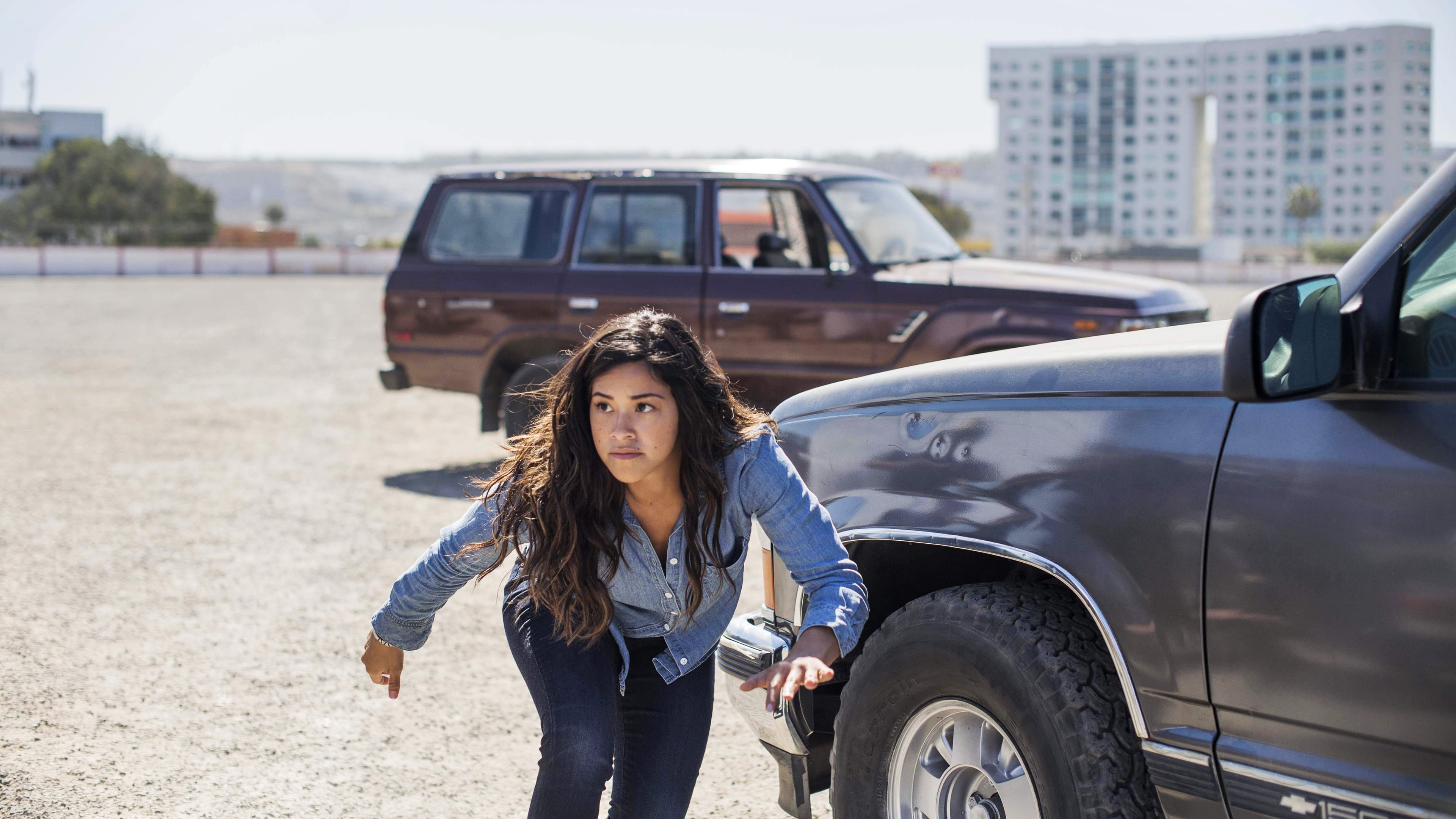 Gina Rodriguez in a parking lot HD Wallpaper
