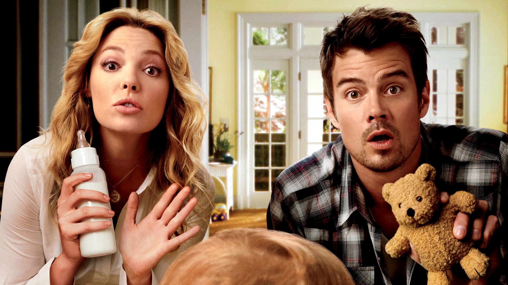 Katherine Heigl and Josh Duhamel with a baby bottle and teddy bear HD Wallpaper