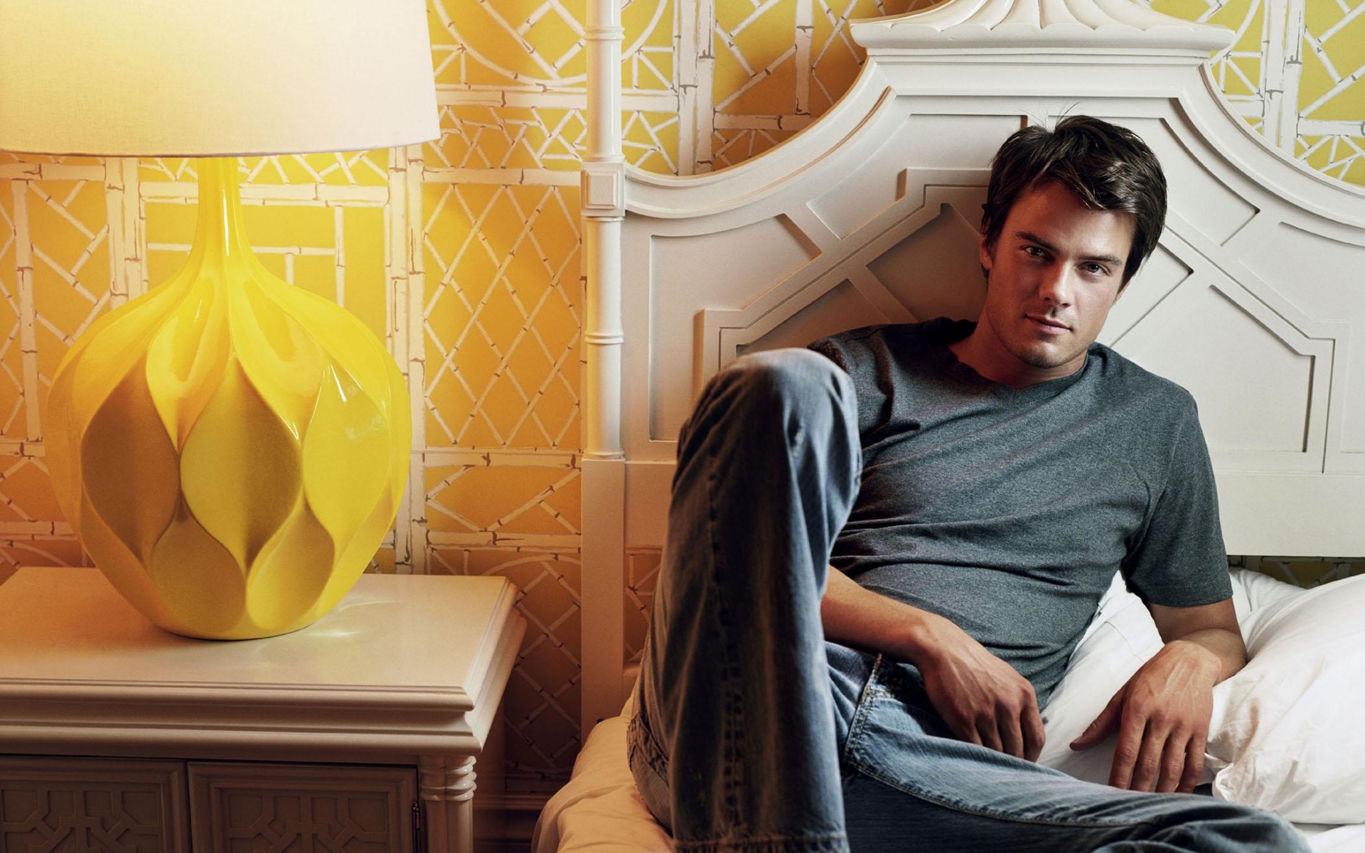 Josh Duhamel sitting on a bed HD Wallpaper