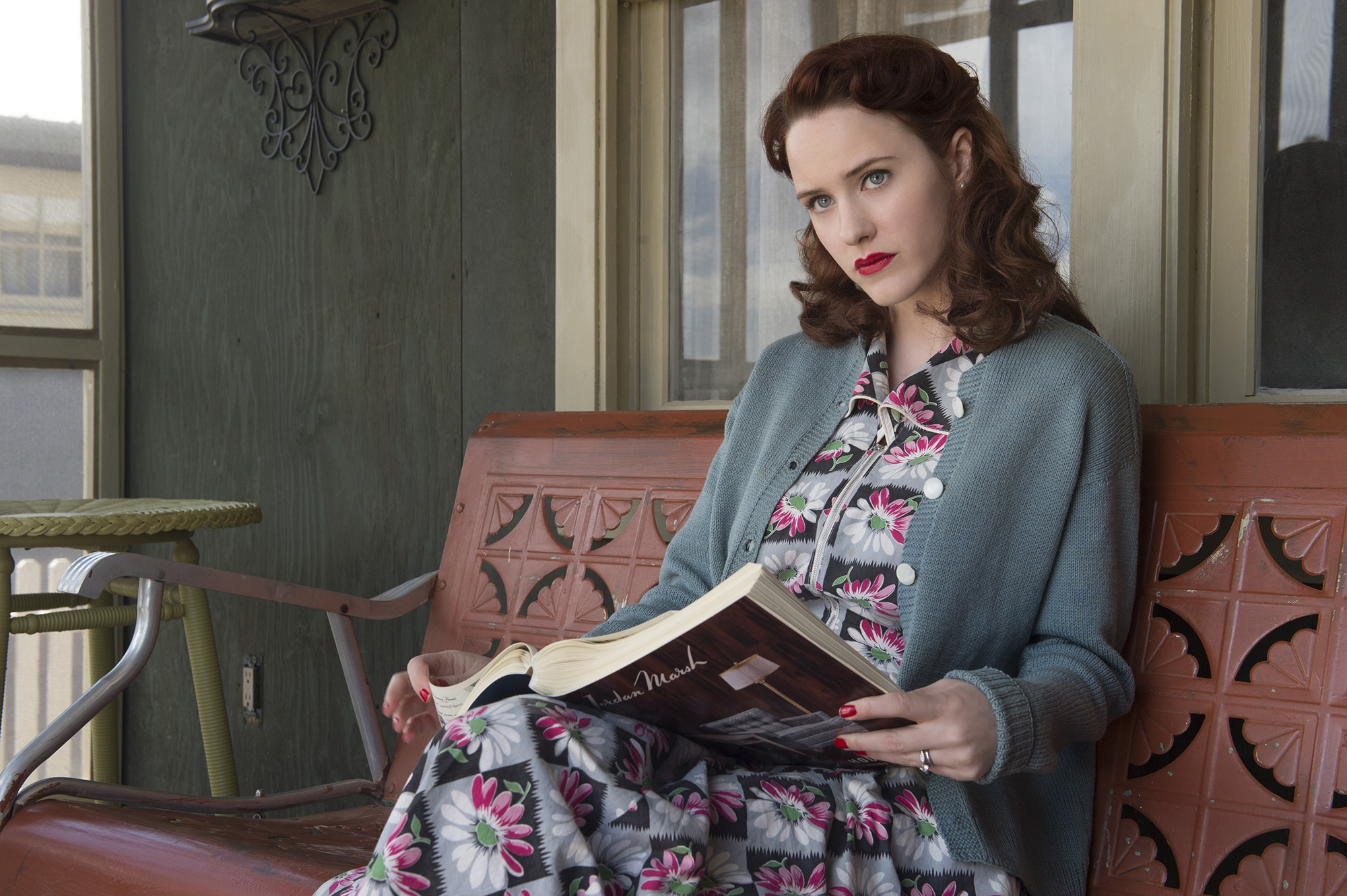 Rachel Brosnahan reading a book on a porch HD Wallpaper