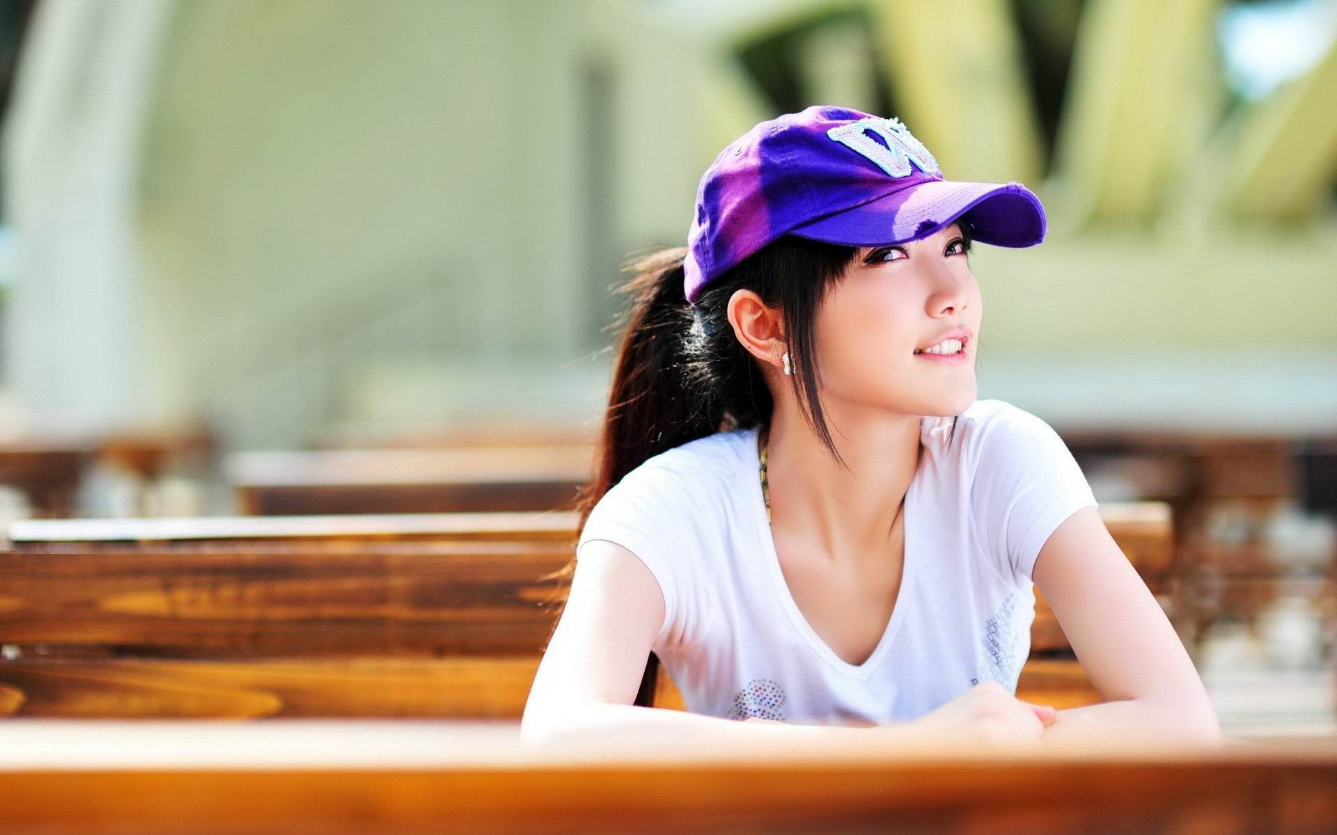 Young woman wearing a purple baseball cap HD Wallpaper