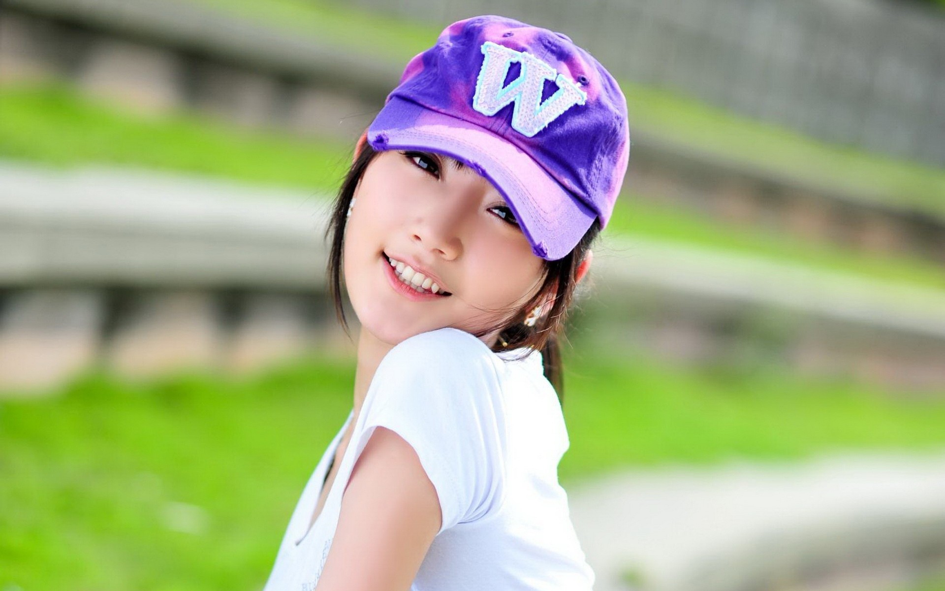 Young woman wearing a purple cap HD Wallpaper