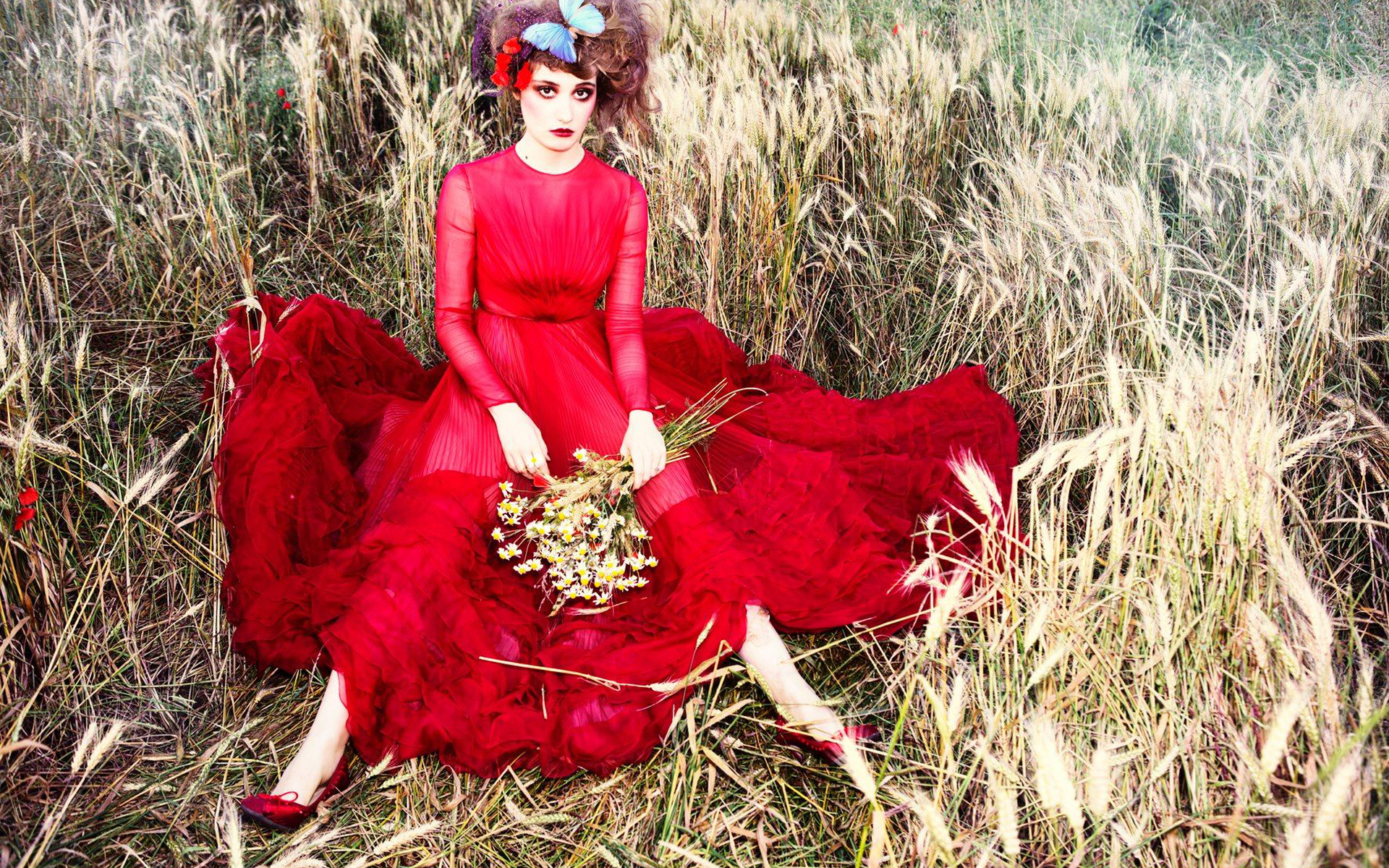 Déborah François in a red dress in a field HD Wallpaper