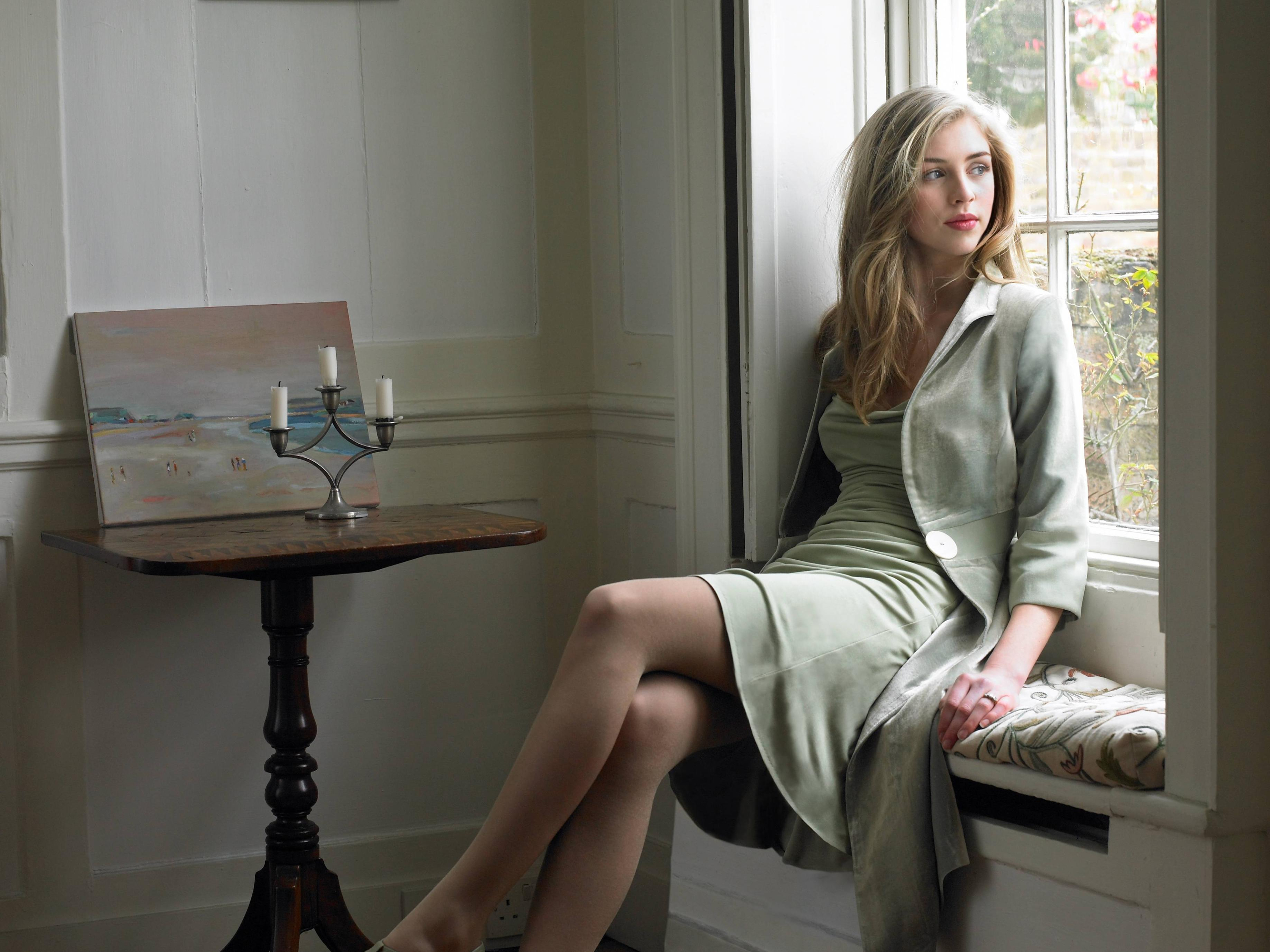 Hermione Corfield in Elegant Light Green Dress by Window HD Wallpaper