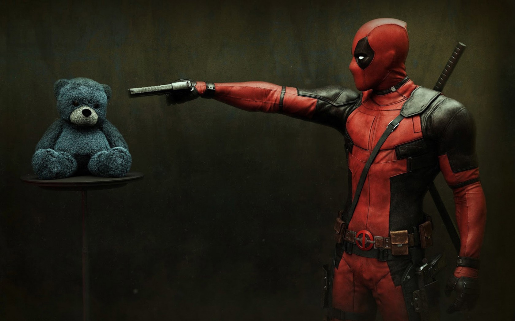 Deadpool aiming a gun at a teddy bear HD Wallpaper