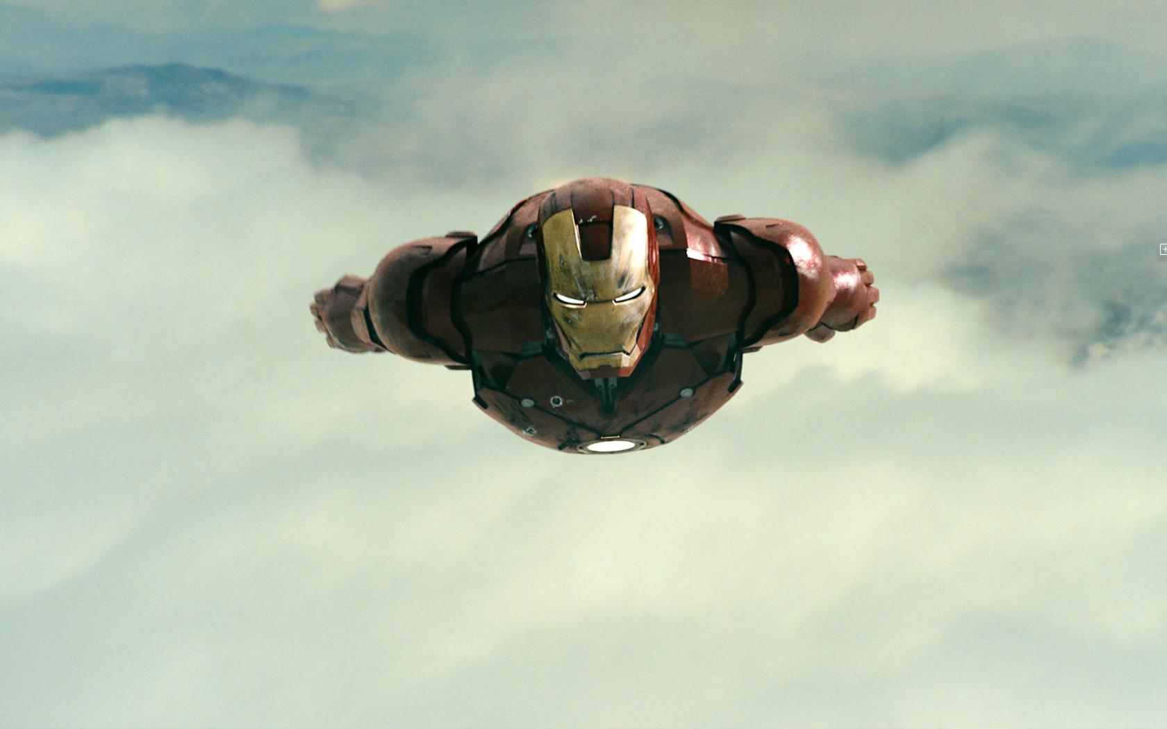 Iron Man flying through clouds HD Wallpaper