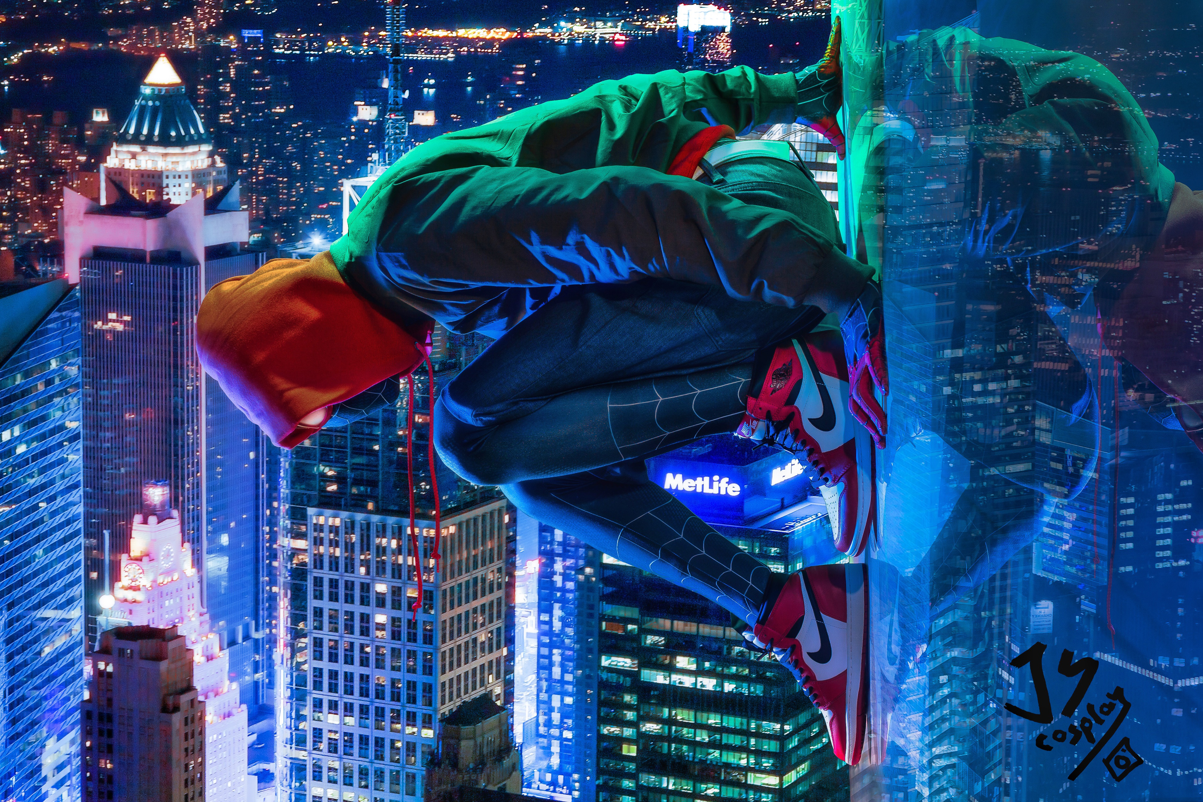 Spider-Man from Marvel hanging on a skyscraper at night HD Wallpaper