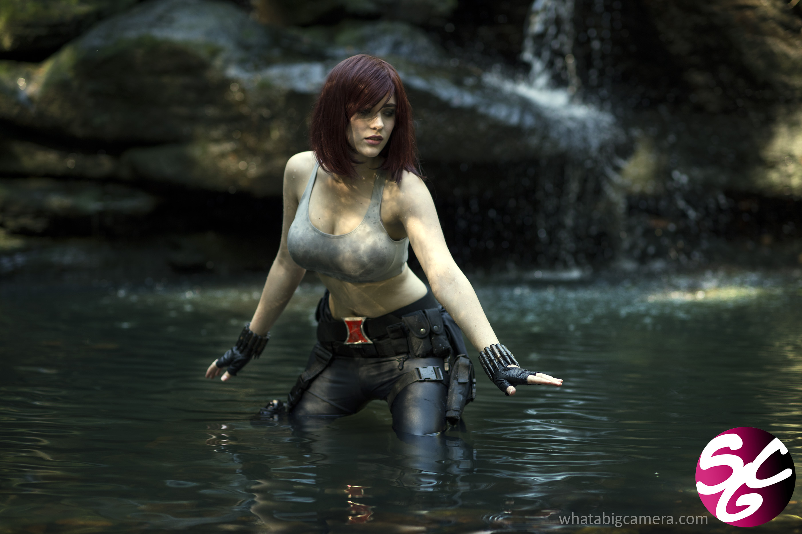 Black Widow in water near waterfall HD Wallpaper