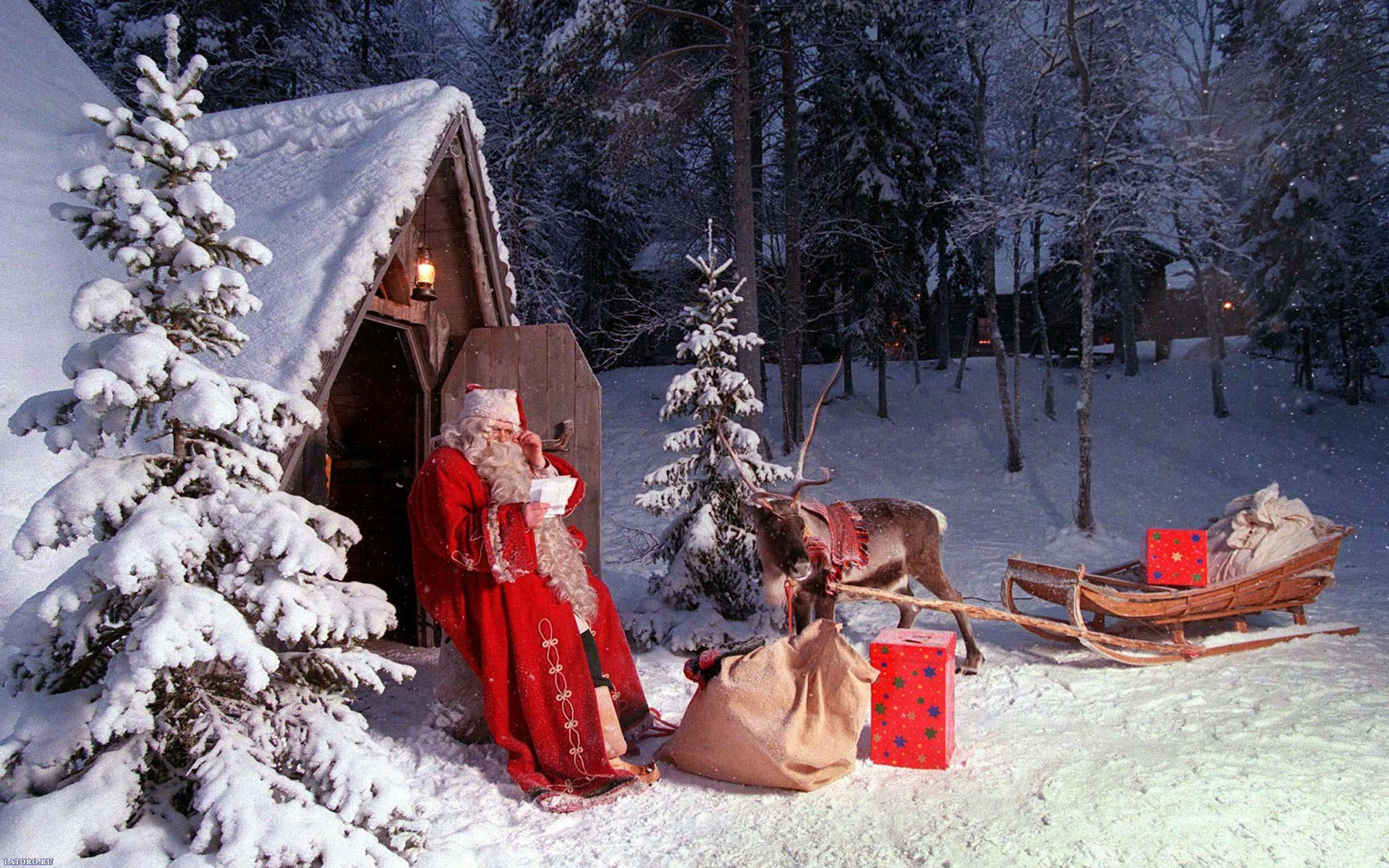 Santa Claus with reindeer and sleigh in snowy forest HD Wallpaper