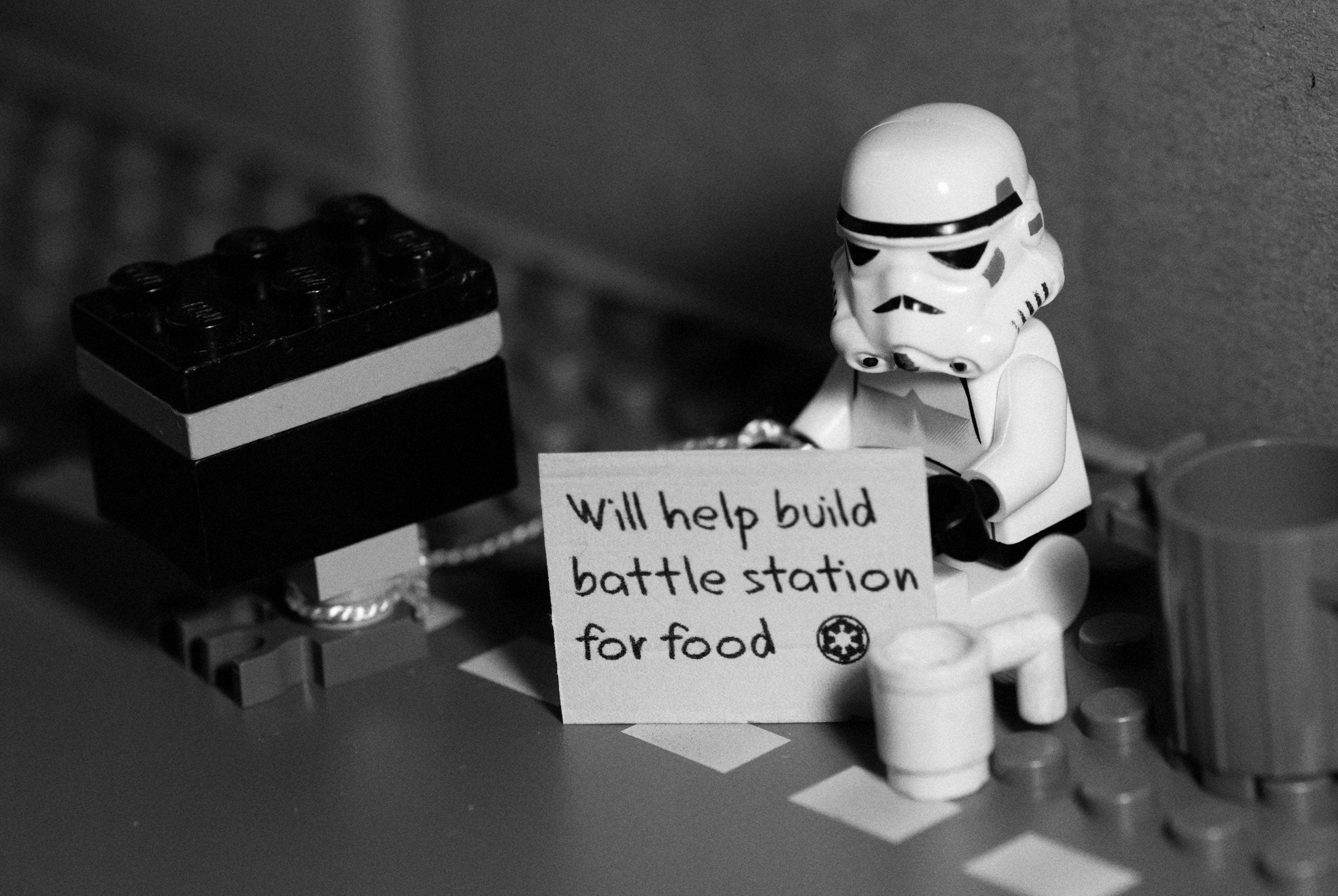 Stormtrooper from Star Wars holding a sign HD Wallpaper