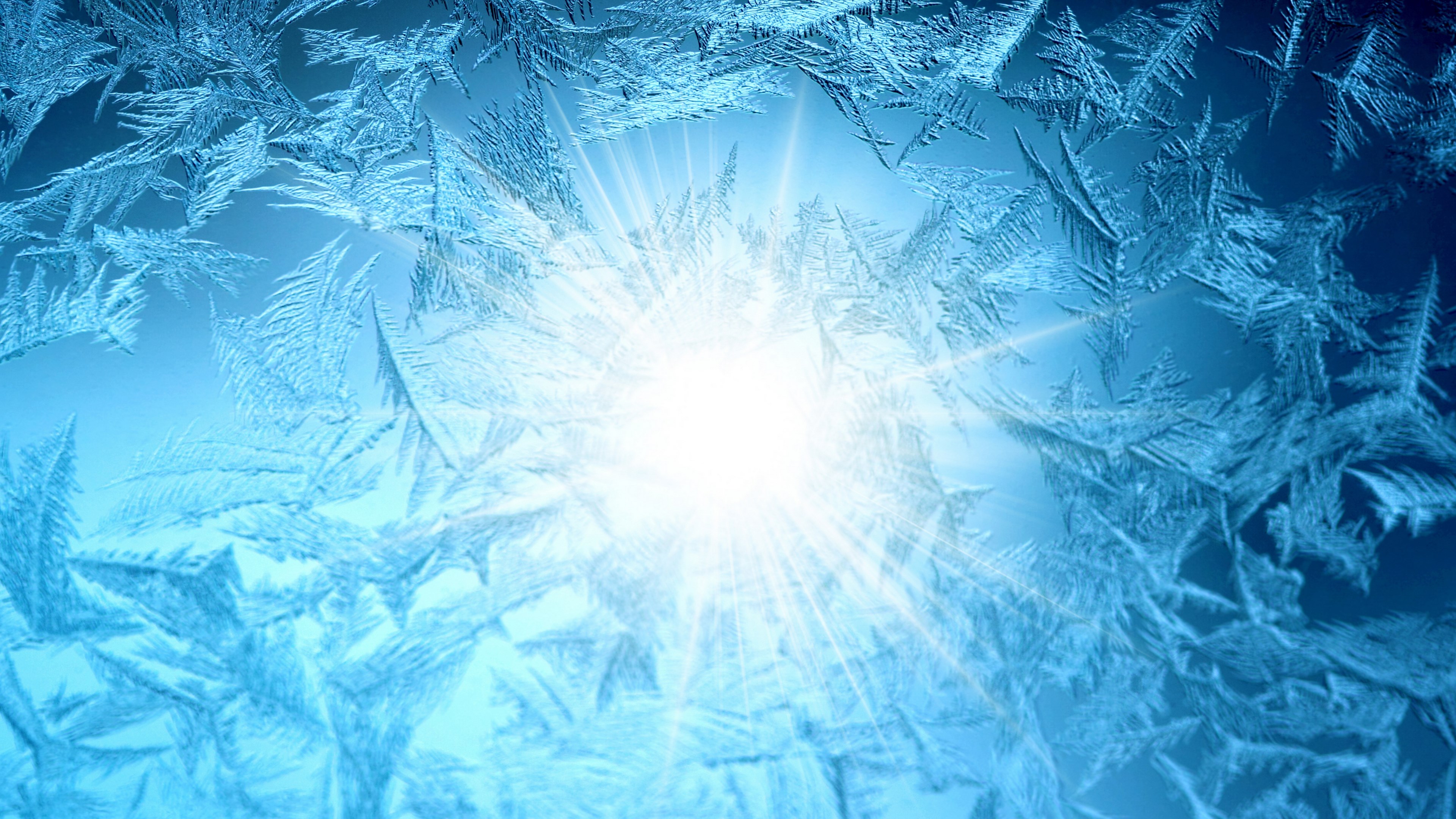 Frost patterns on a window with sunlight HD Wallpaper
