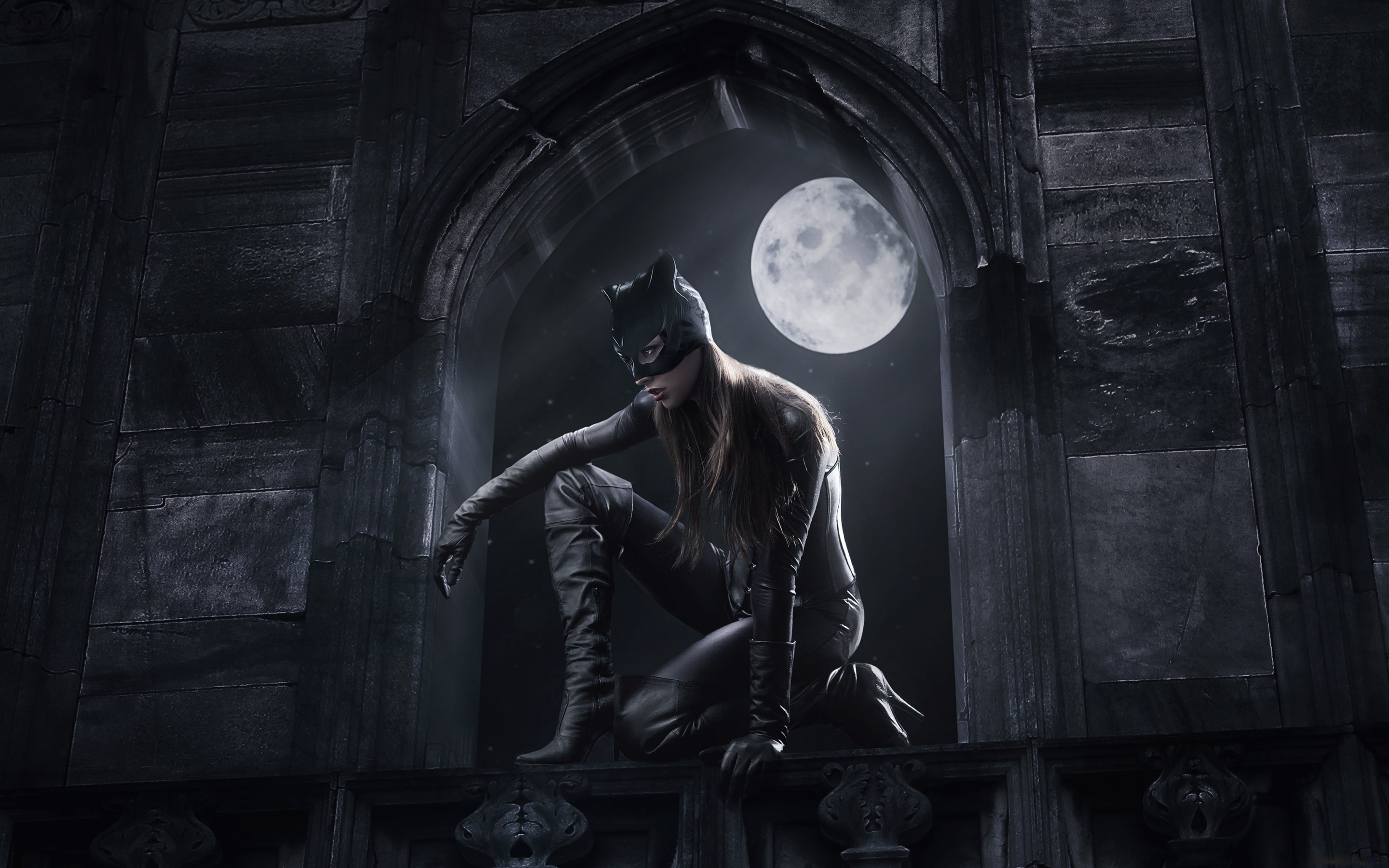 Catwoman crouching on a ledge under the moon HD Wallpaper