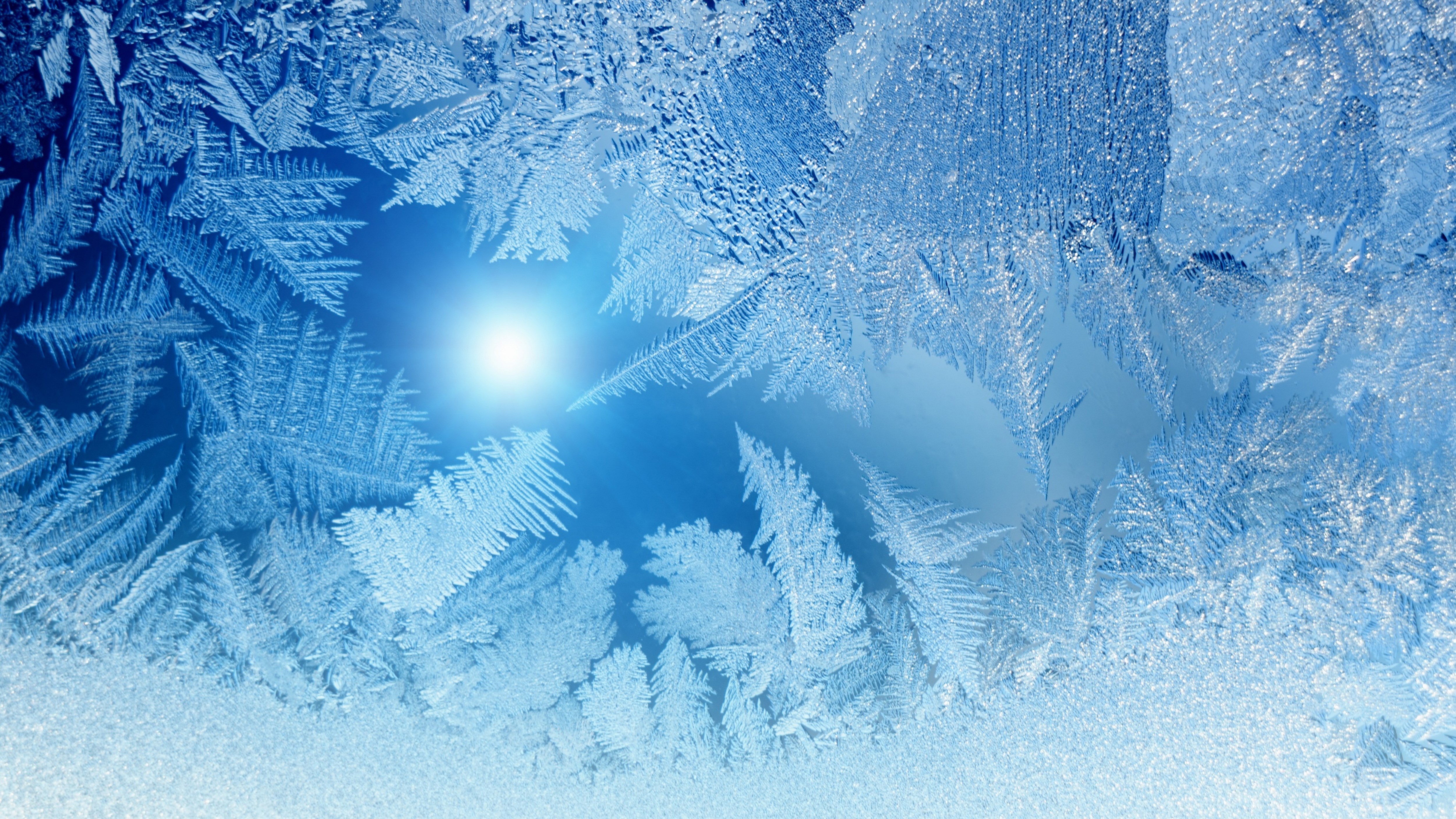 Frost patterns on a window with sunlight HD Wallpaper
