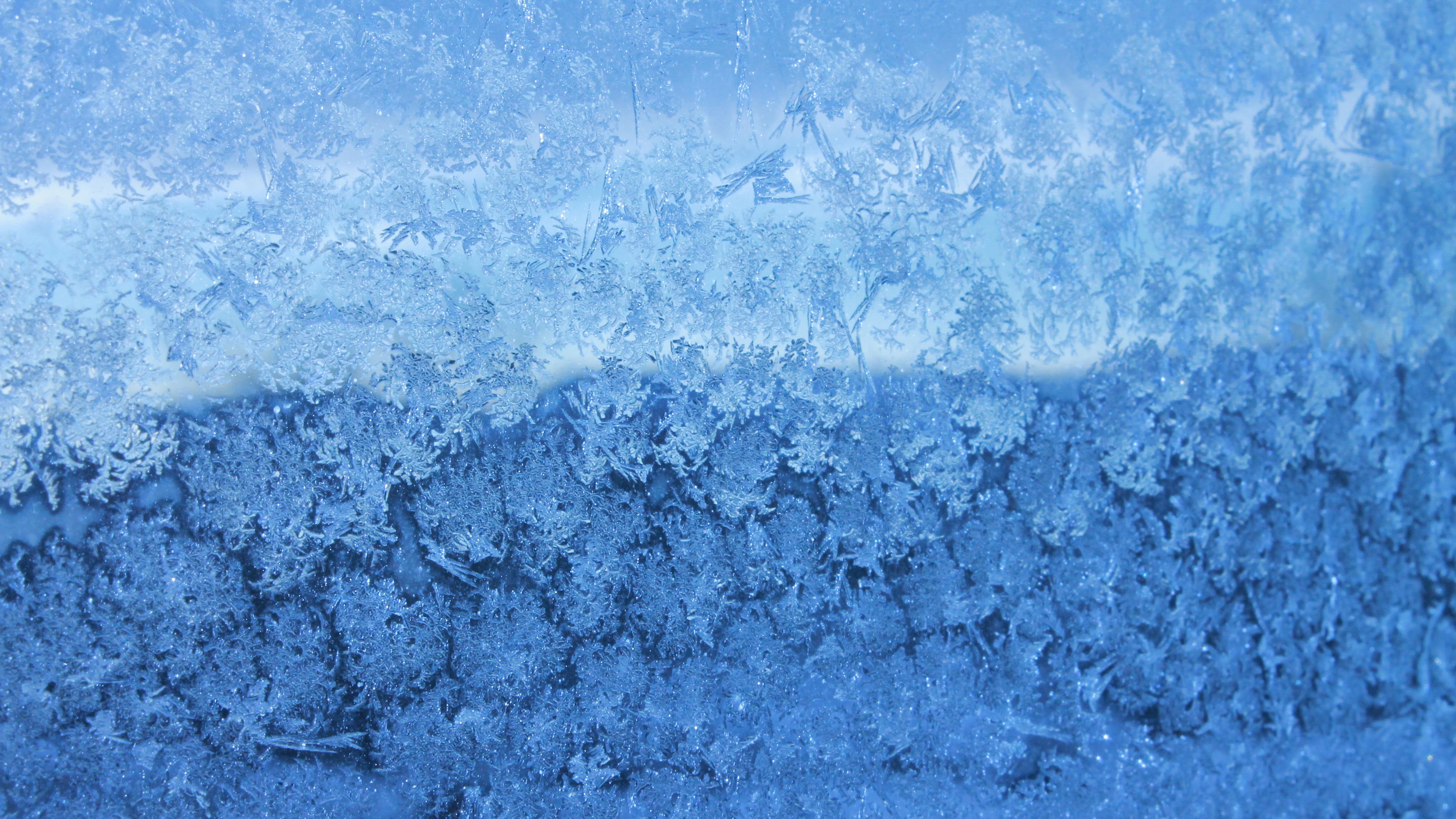 Frost patterns on a blue surface HD Wallpaper