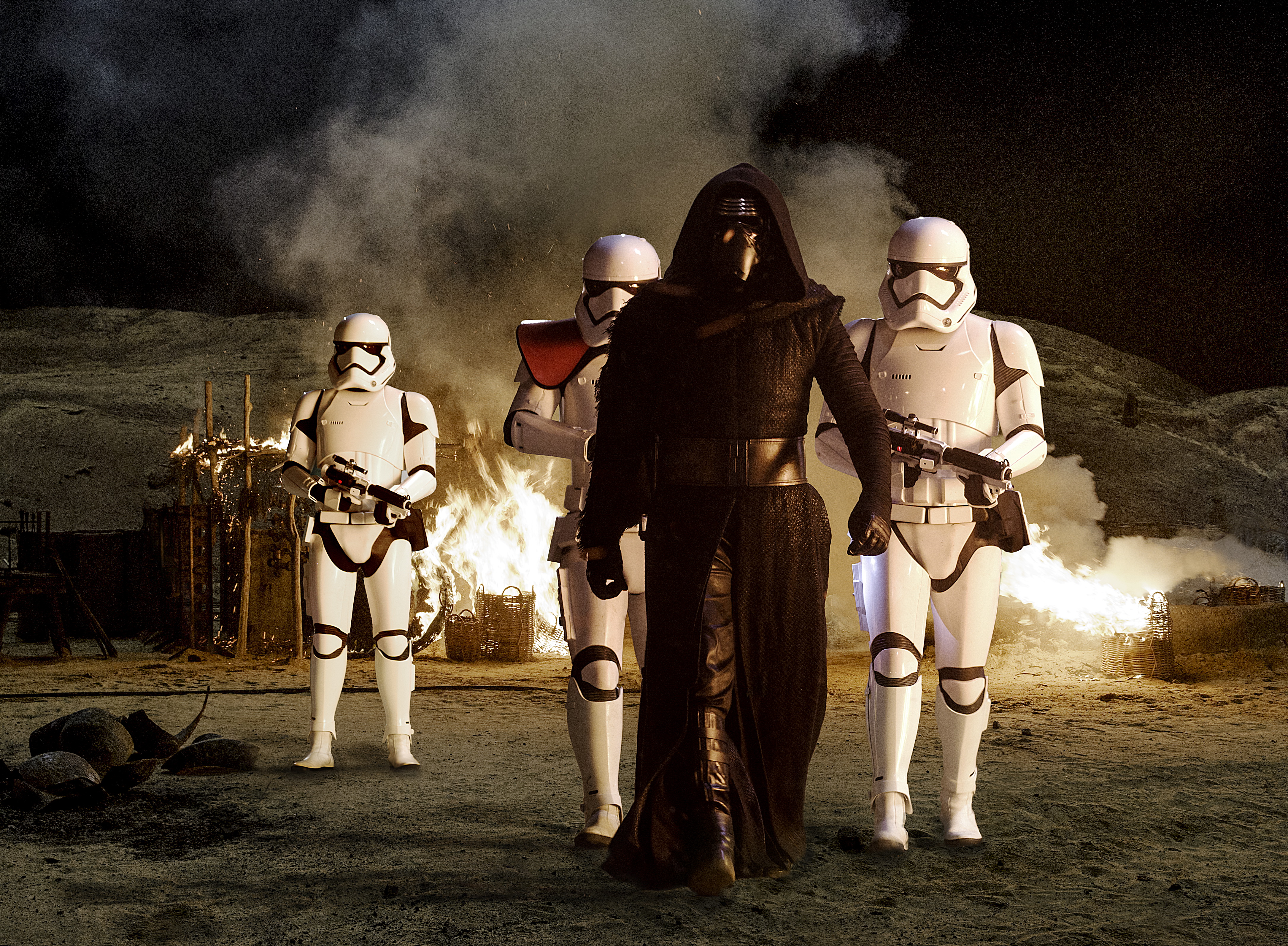 Kylo Ren and Stormtroopers in a fiery scene HD Wallpaper