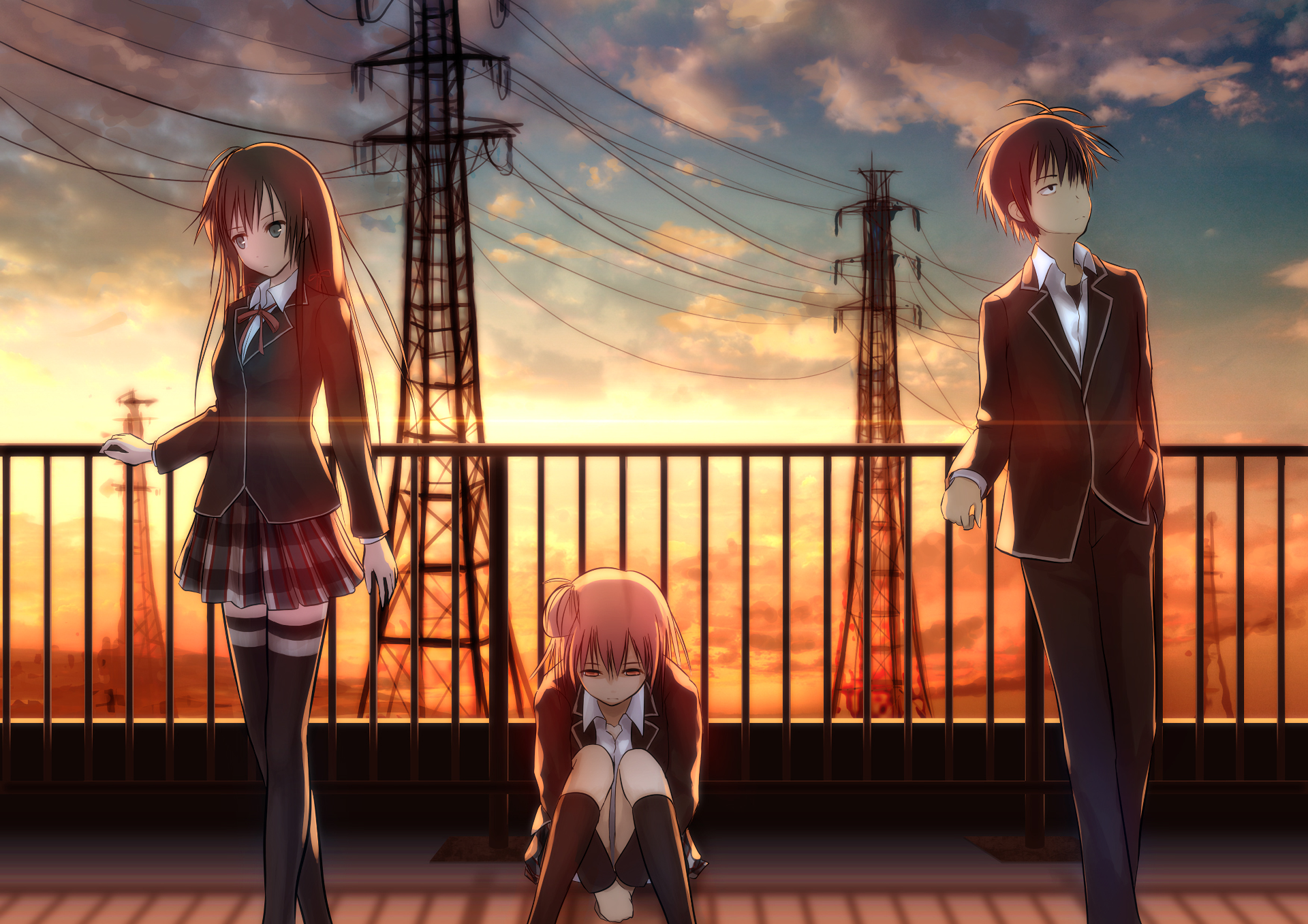 Three students on a rooftop at sunset HD Wallpaper